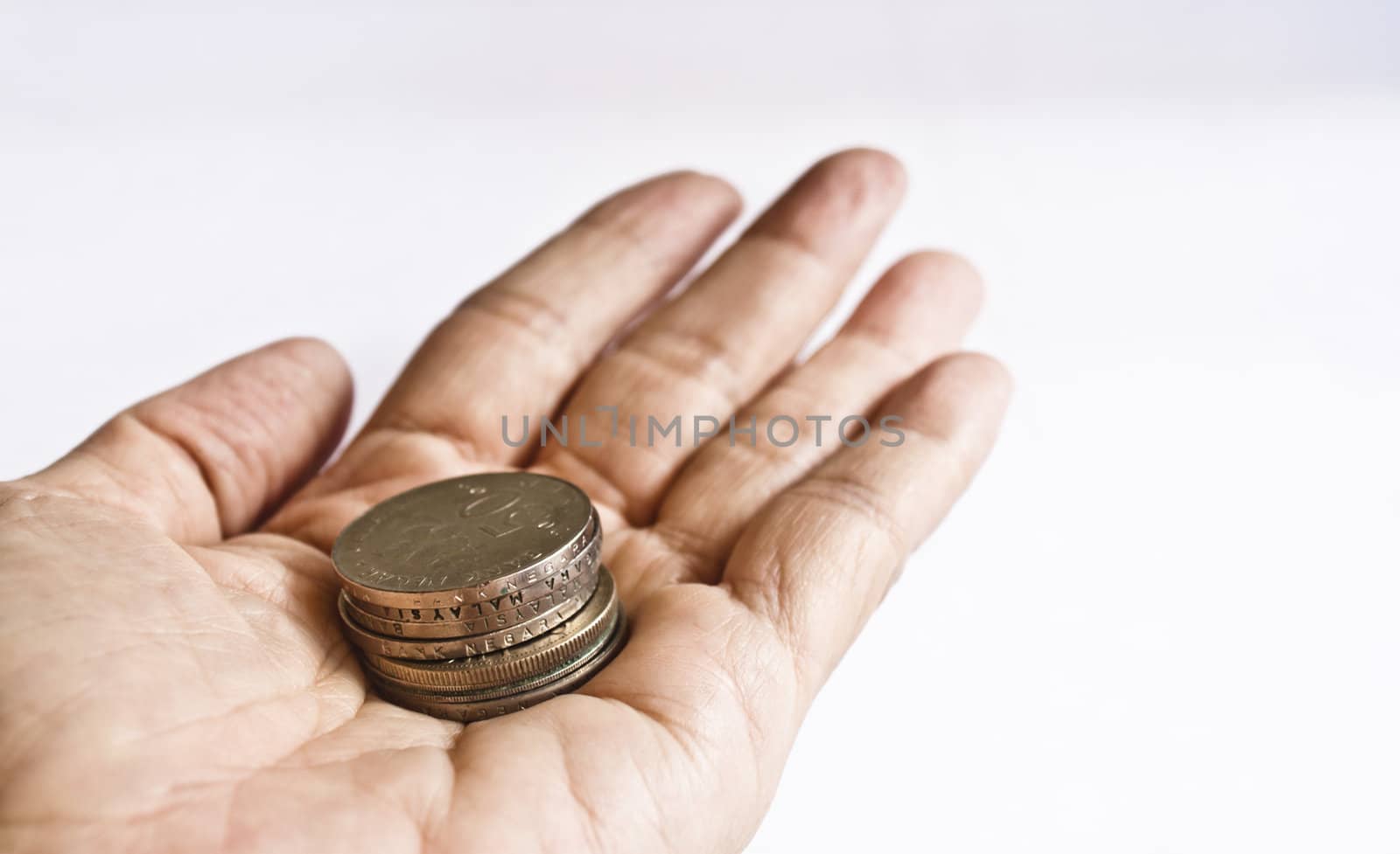 A show of some coins in a stretched out hand
