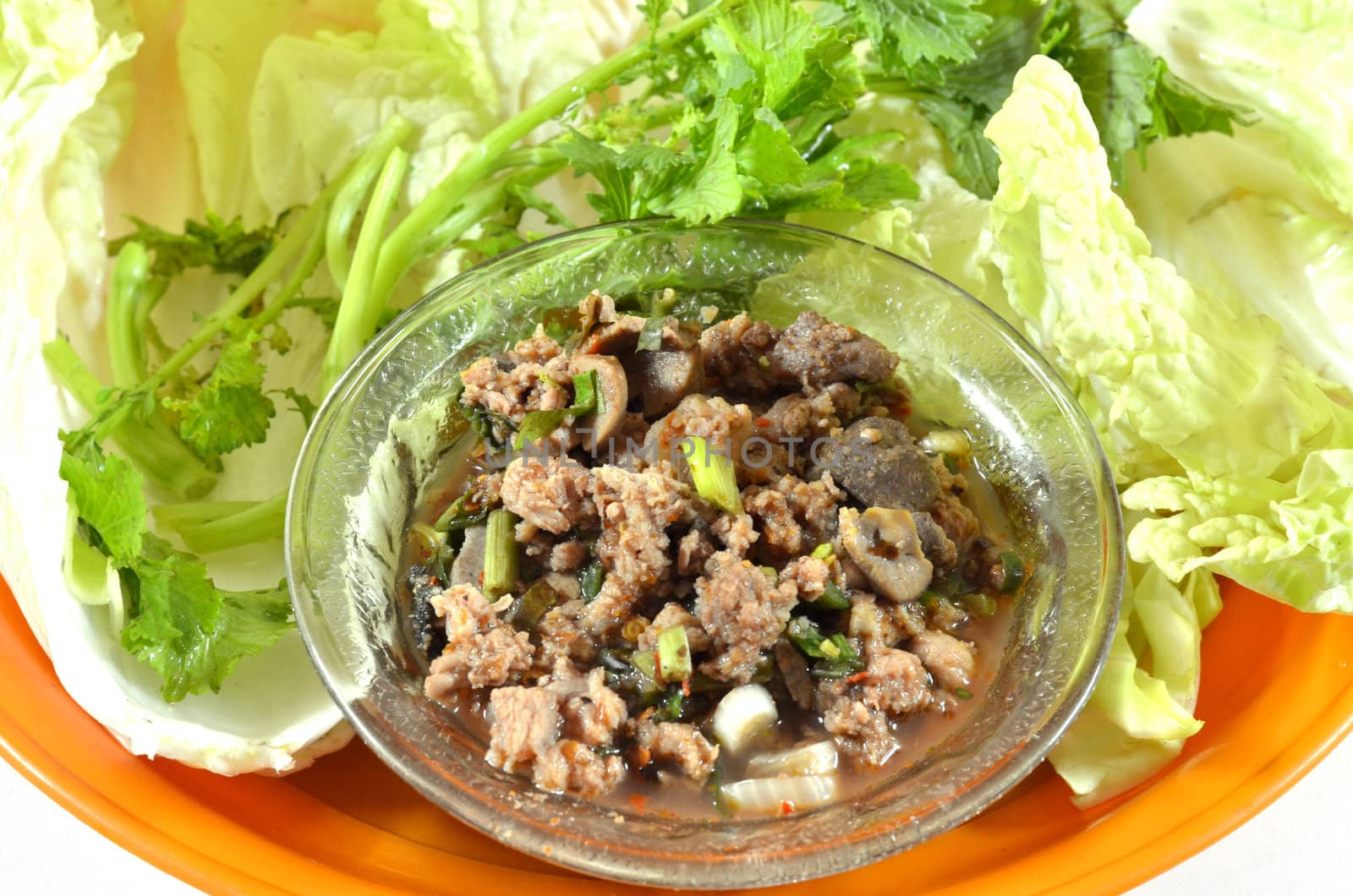 Thai dish of spicy minced pork eaten with vegetable