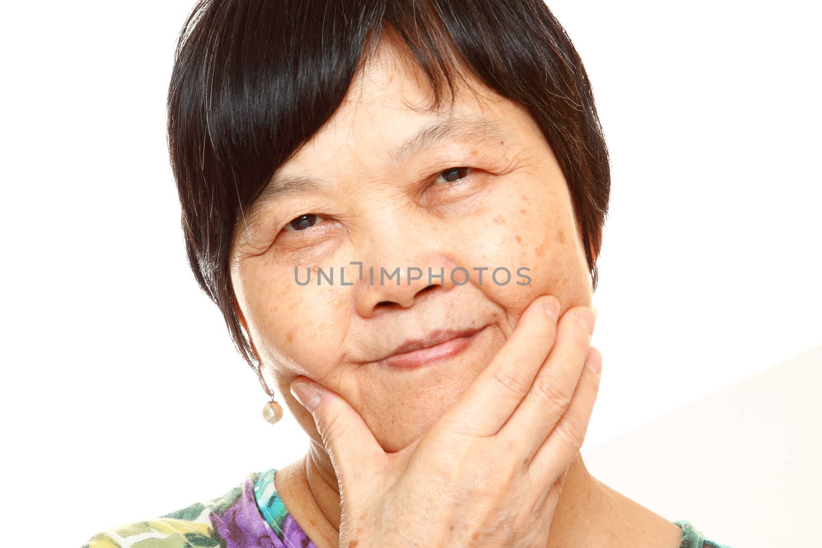 Senior Asian with hand