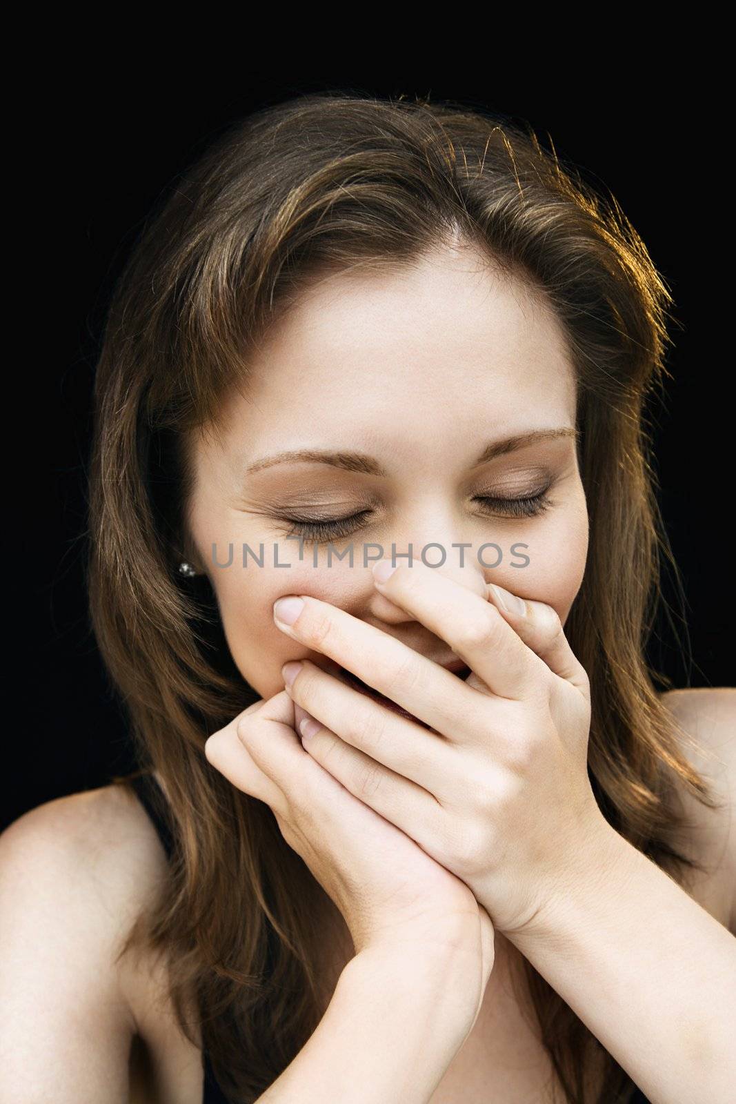 Pretty woman laughing. by iofoto