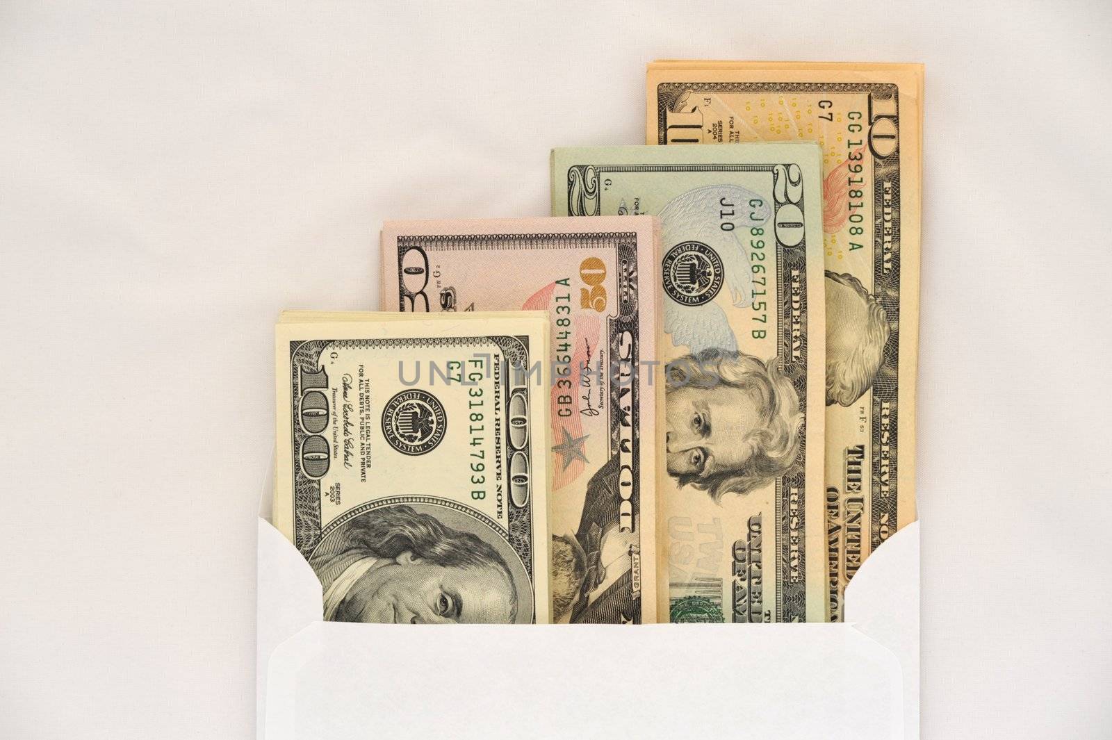 American Dollars in White Envelope on a White 
Background.
