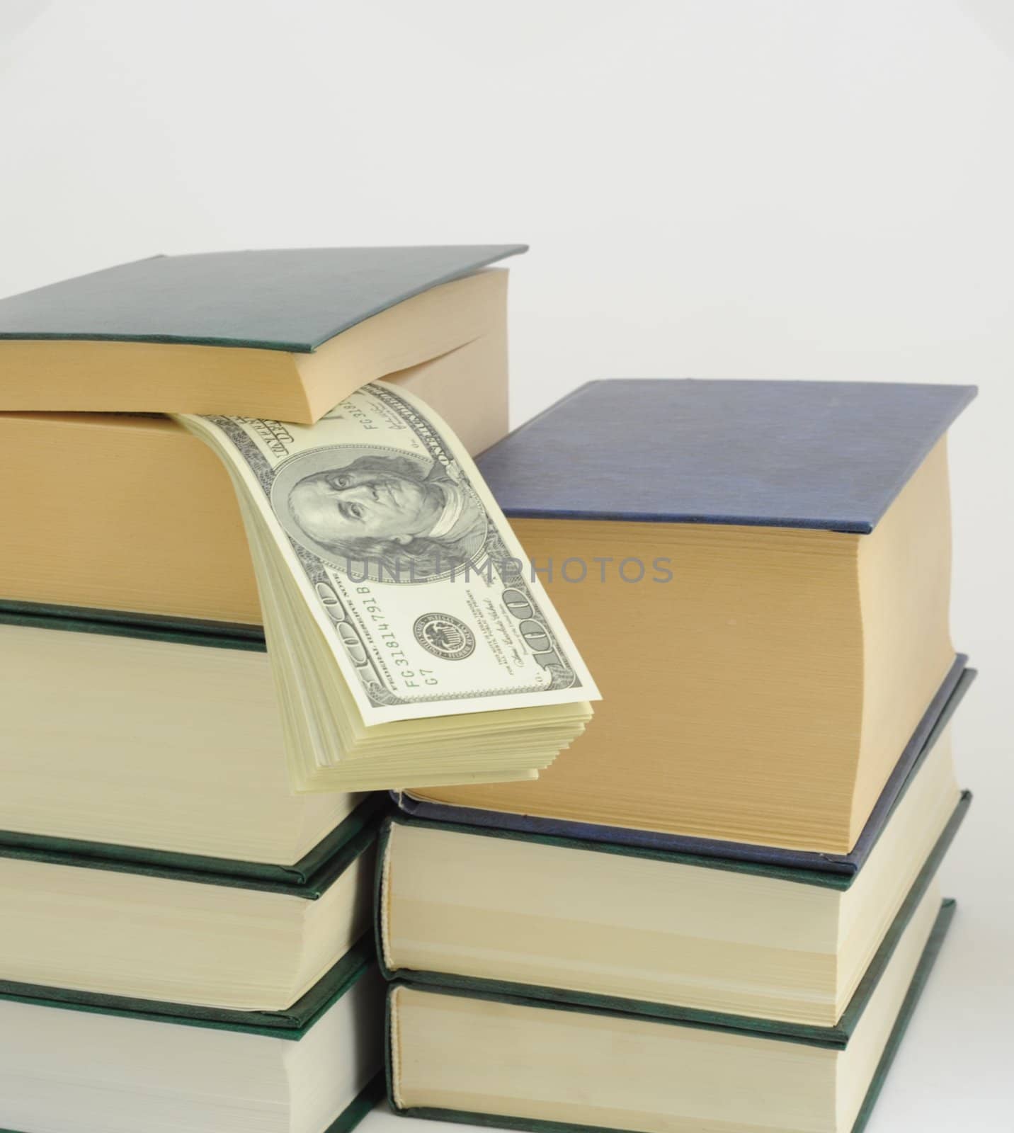 Money in Book on White Background. Save 
Bookmark in Hundred Dollars.