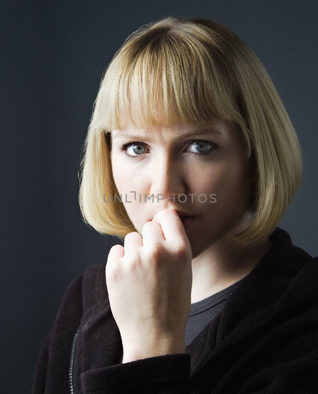Young caucasian woman looking contemplative.