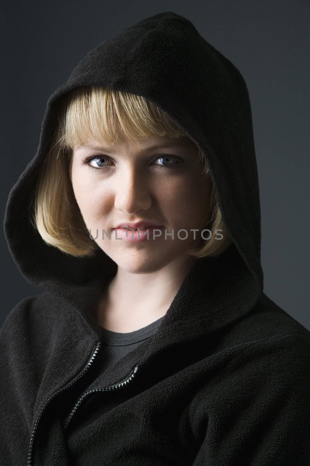 Portrait of young caucasian woman wearing sweatshirt.