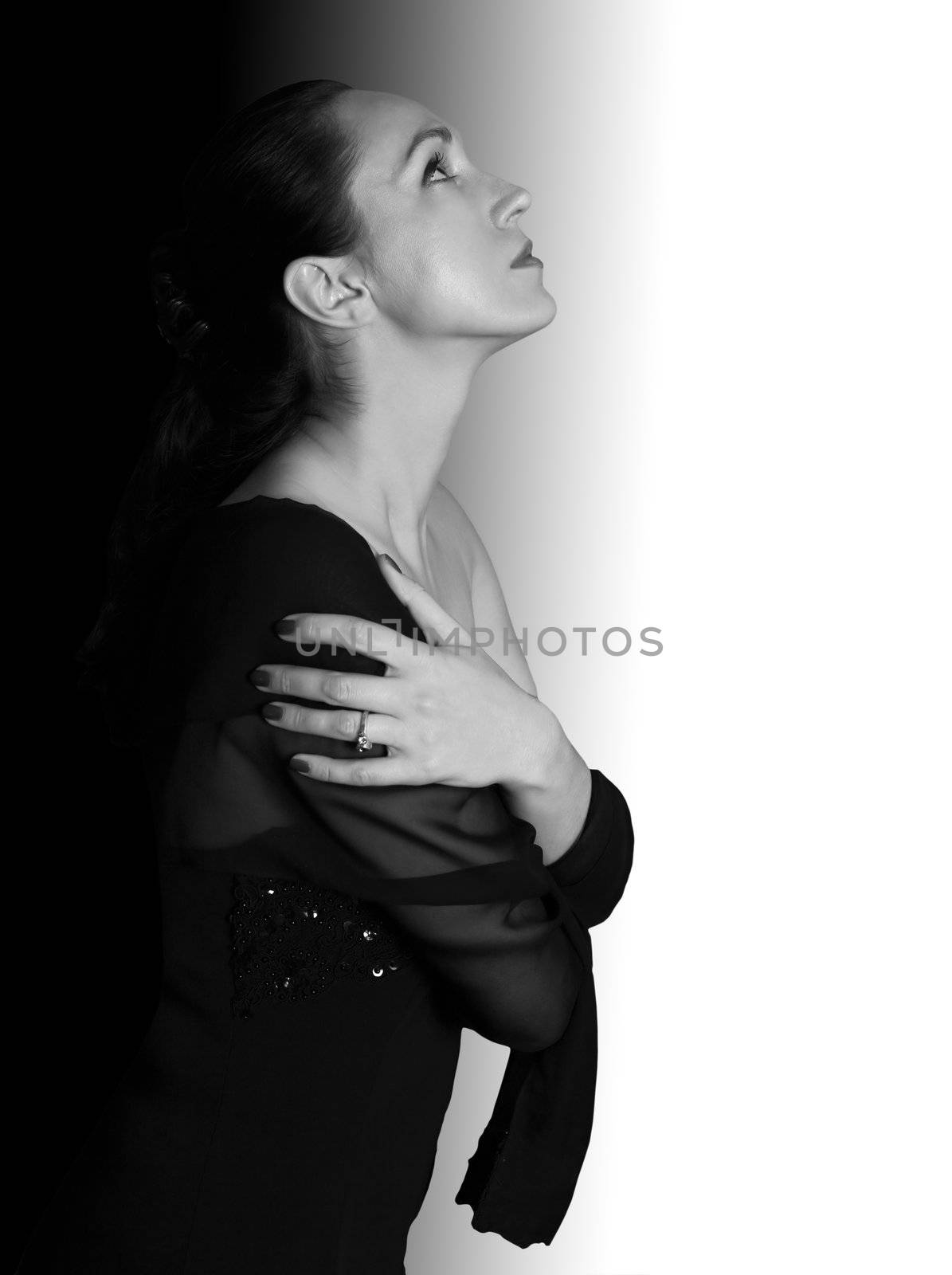 Beautiful woman on a black-and-white background in studio