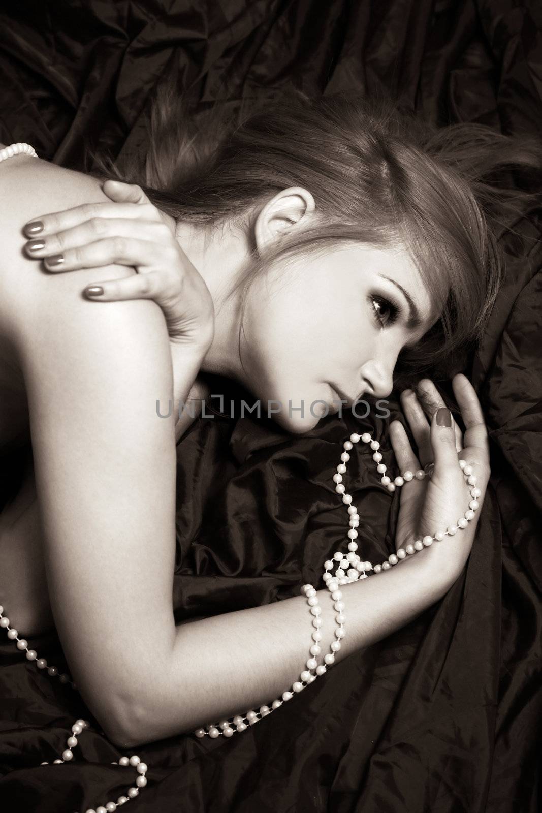 Portrait of a fine woman with a beads