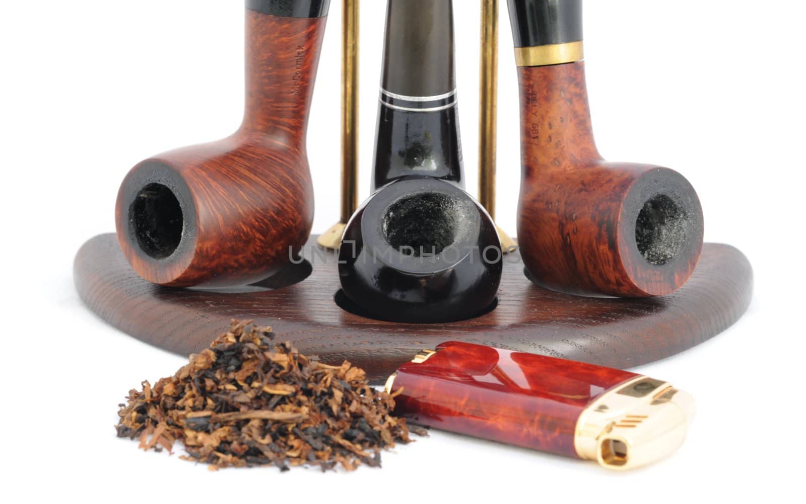 Tobacco,  Lighter and Three Smoking Pipes on the Stand. 