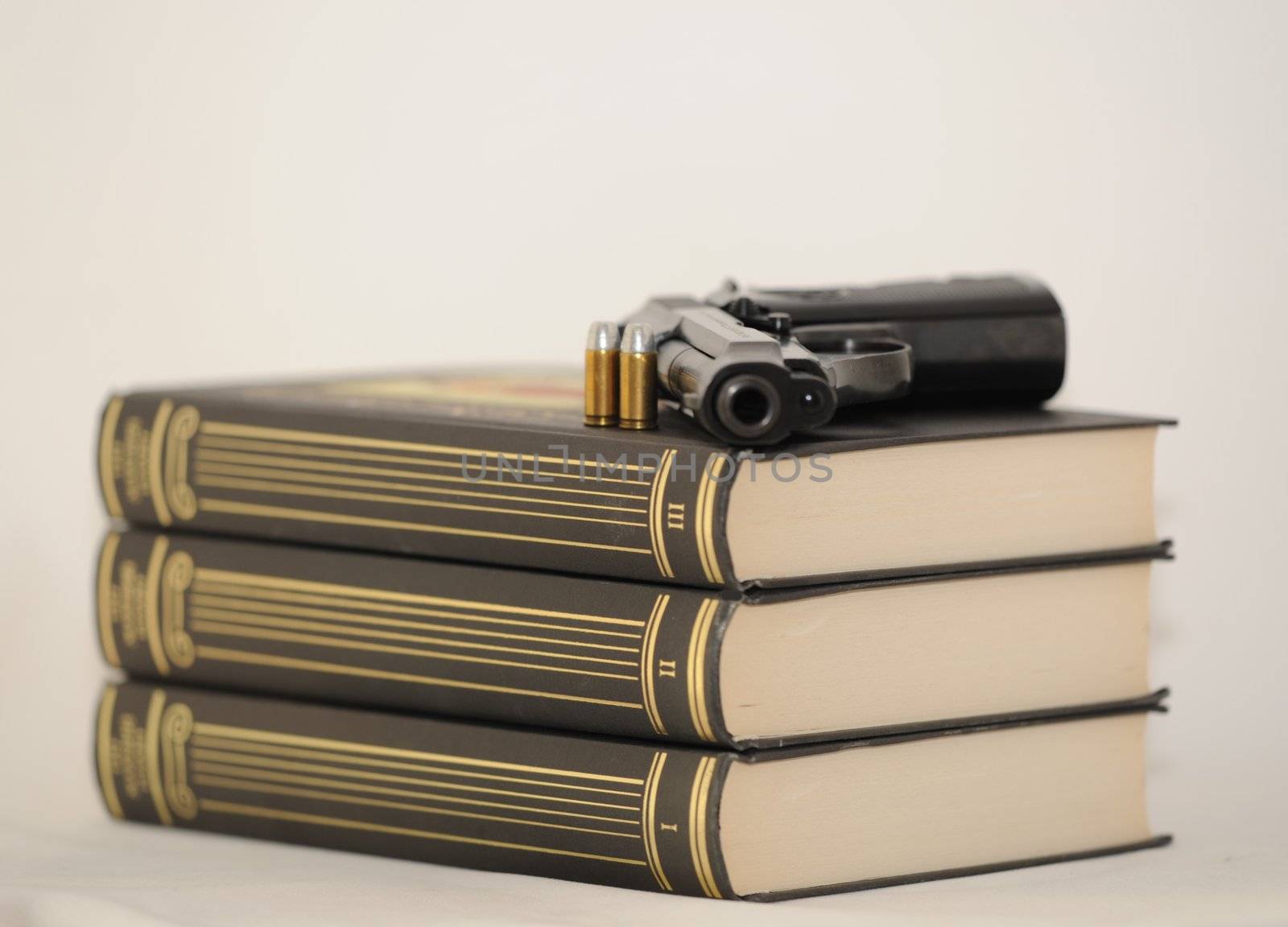 Pistol And Cartridges On Three Books. 
Detective Story.