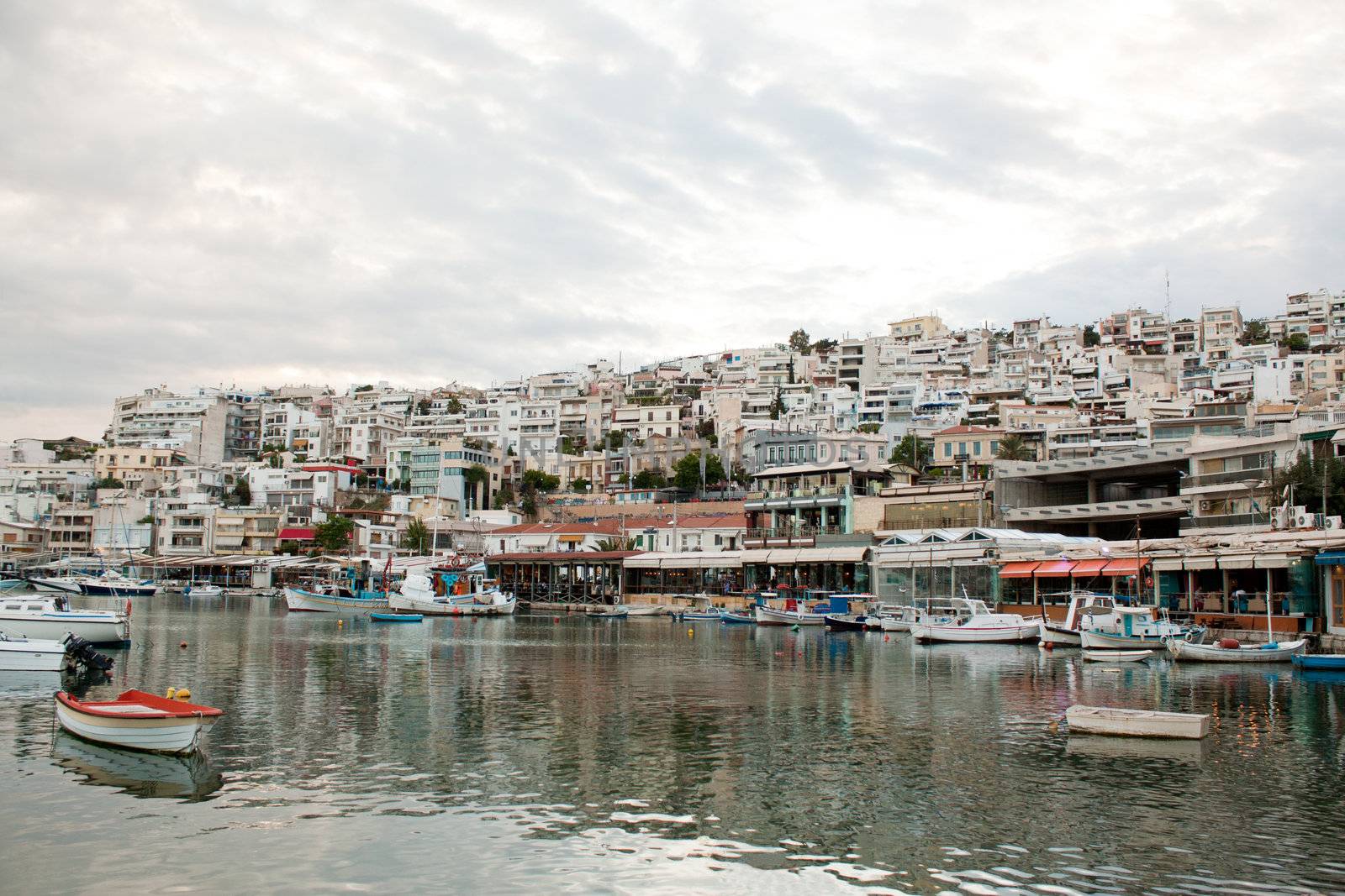 View of Mikrolimano Port in Piraeus, near Athens, Greece, at sunset.