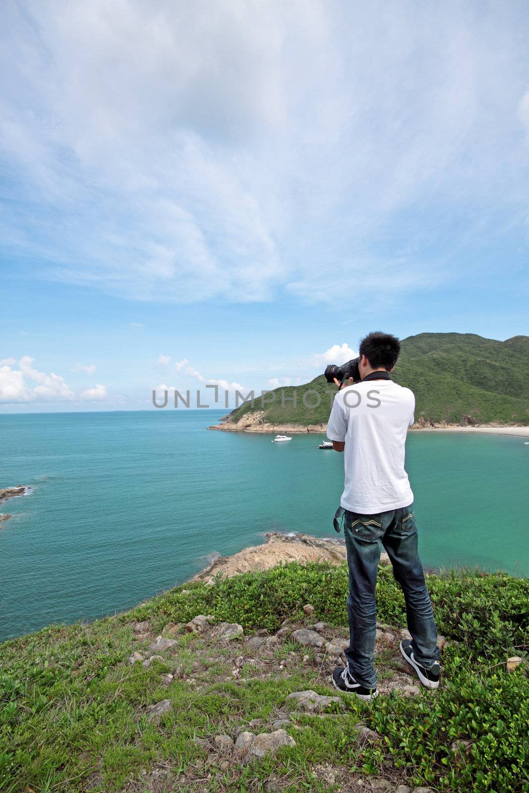 photographer takes a photo of the landscape 