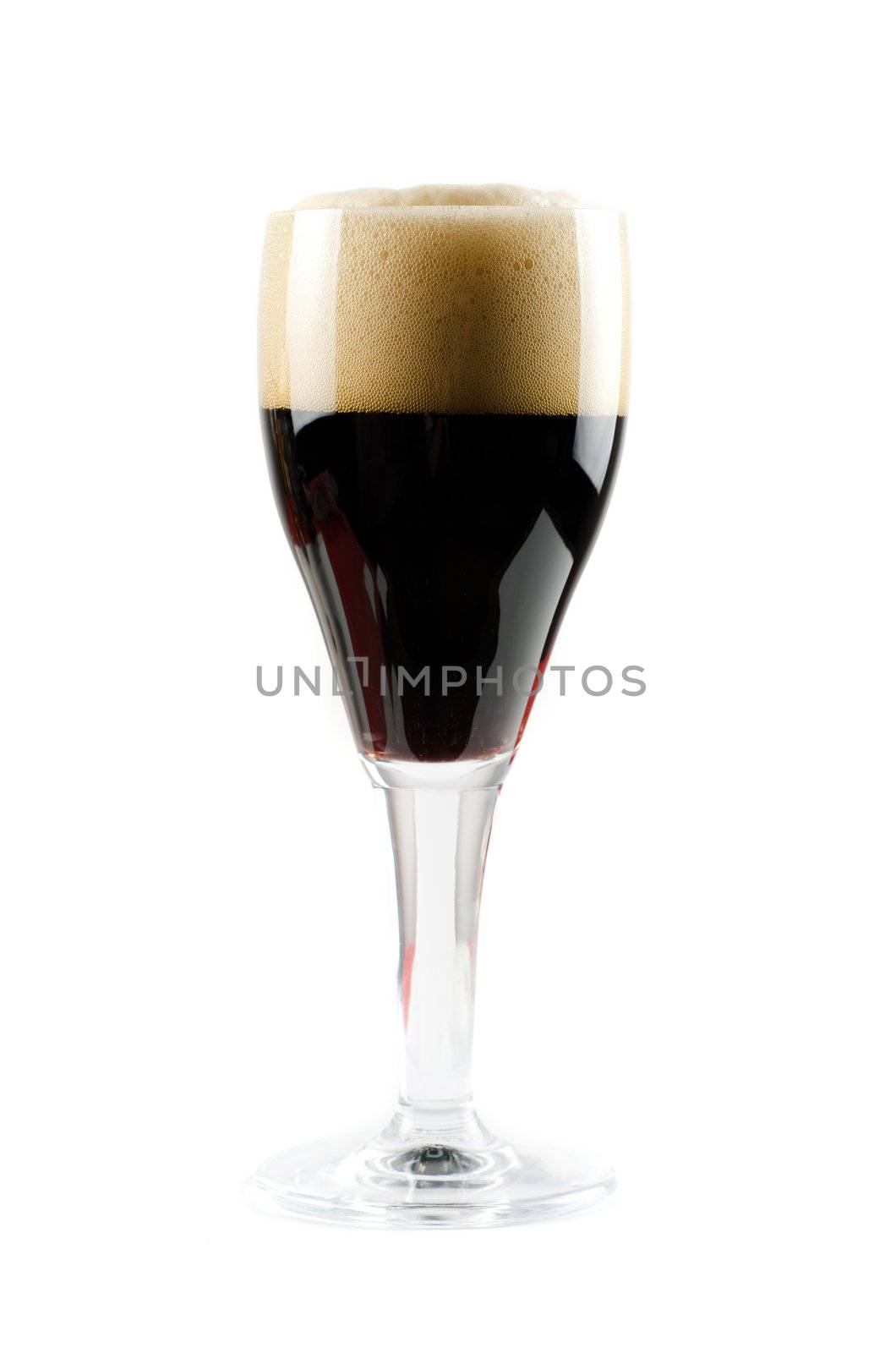 Glass of dark beer isolated on a white background