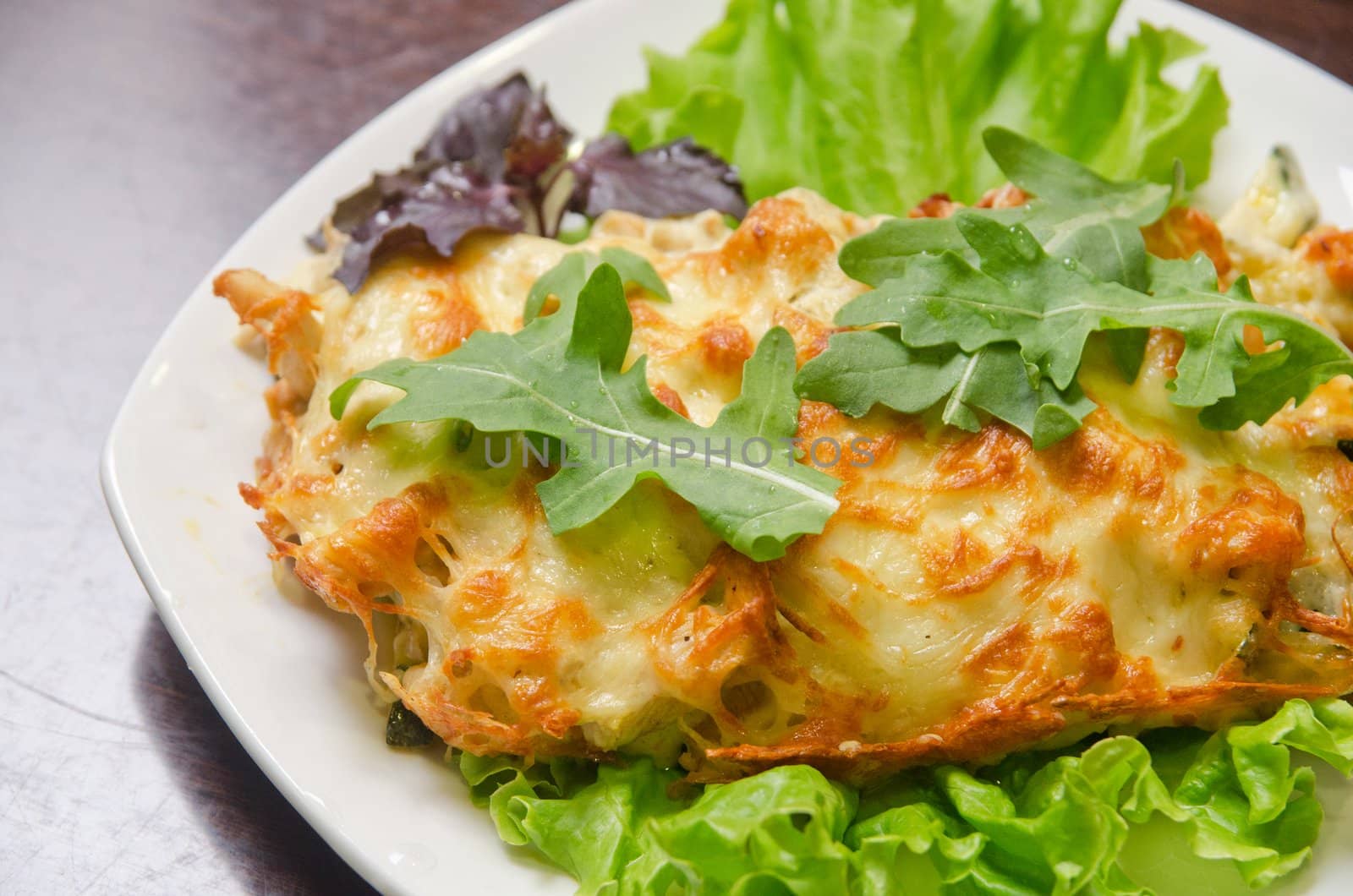 chicken fillet baked with zucchini, rucola lettuce