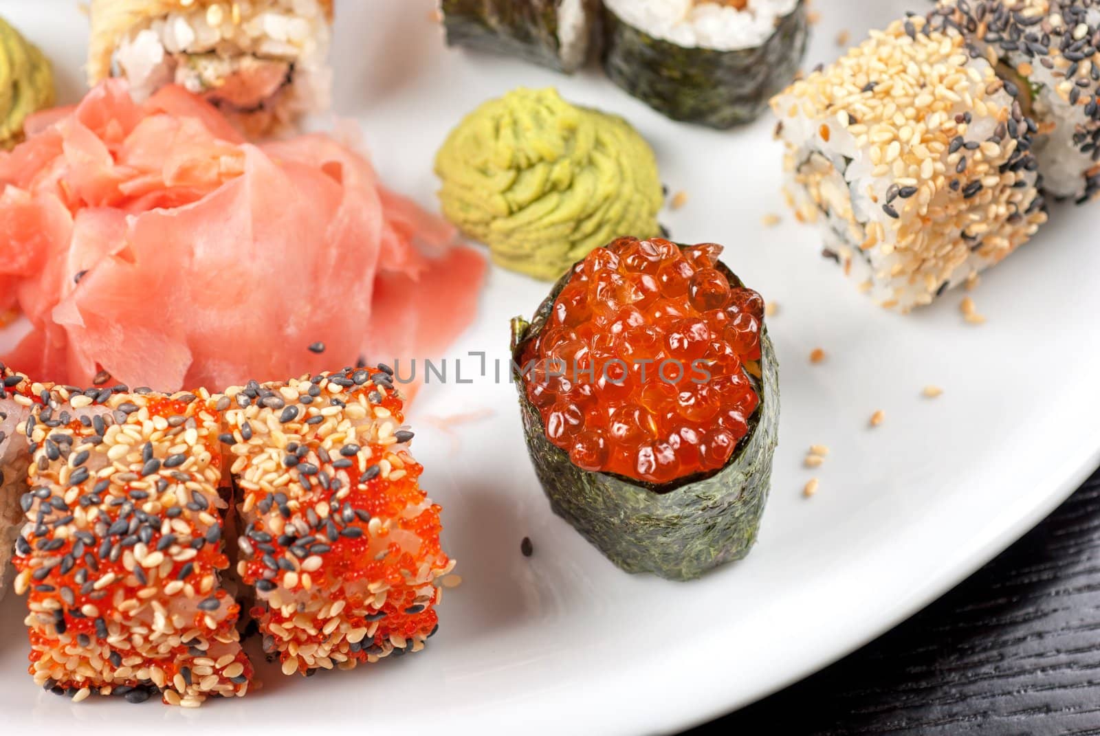 japanese sushi set with red caviar sushi in the foreground