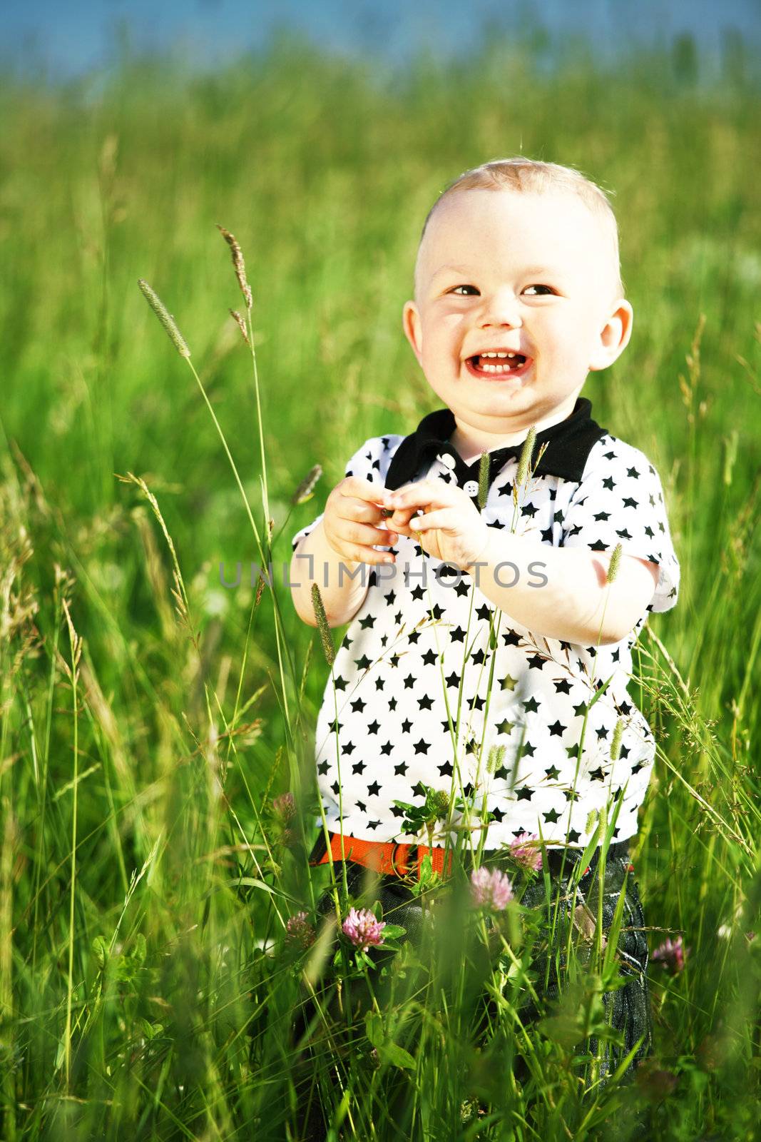 boy in grass by Yellowj