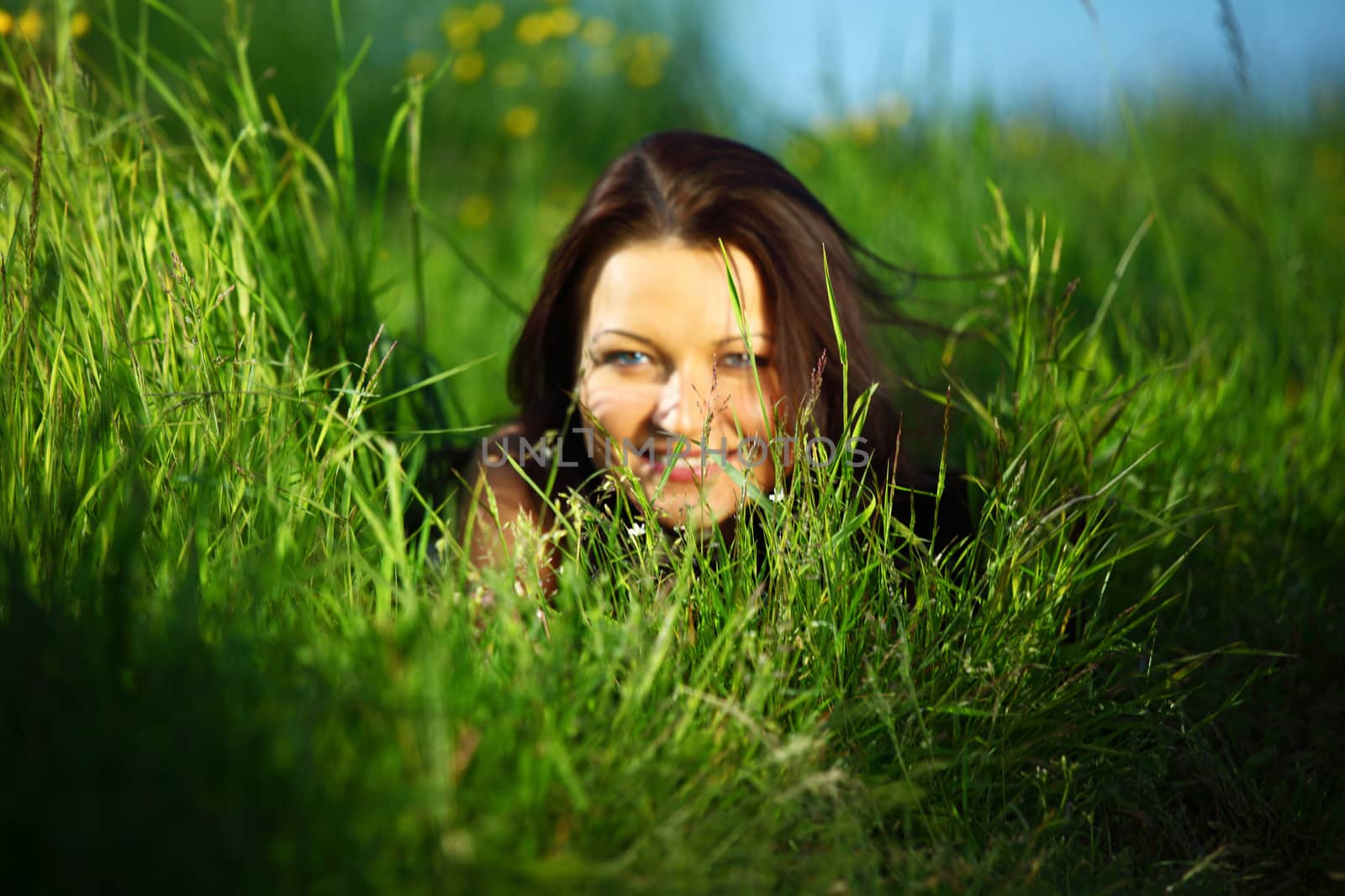  happy woman lay on green grass