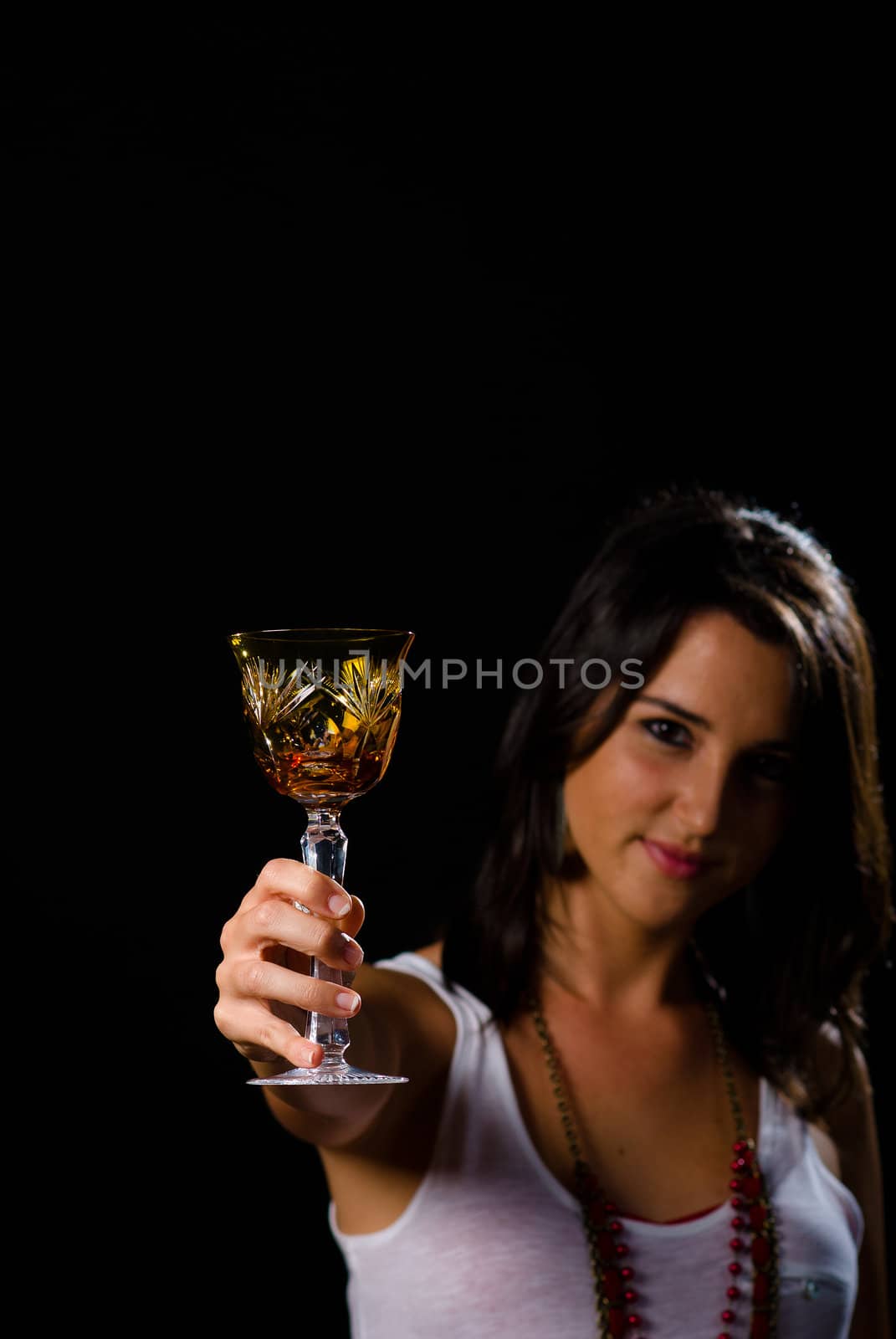 Brunette toasting with a classy crystal wine glass