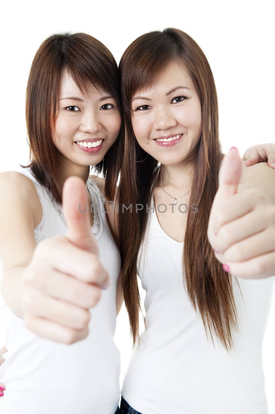 Young Asian University student giving thumbs up sign.