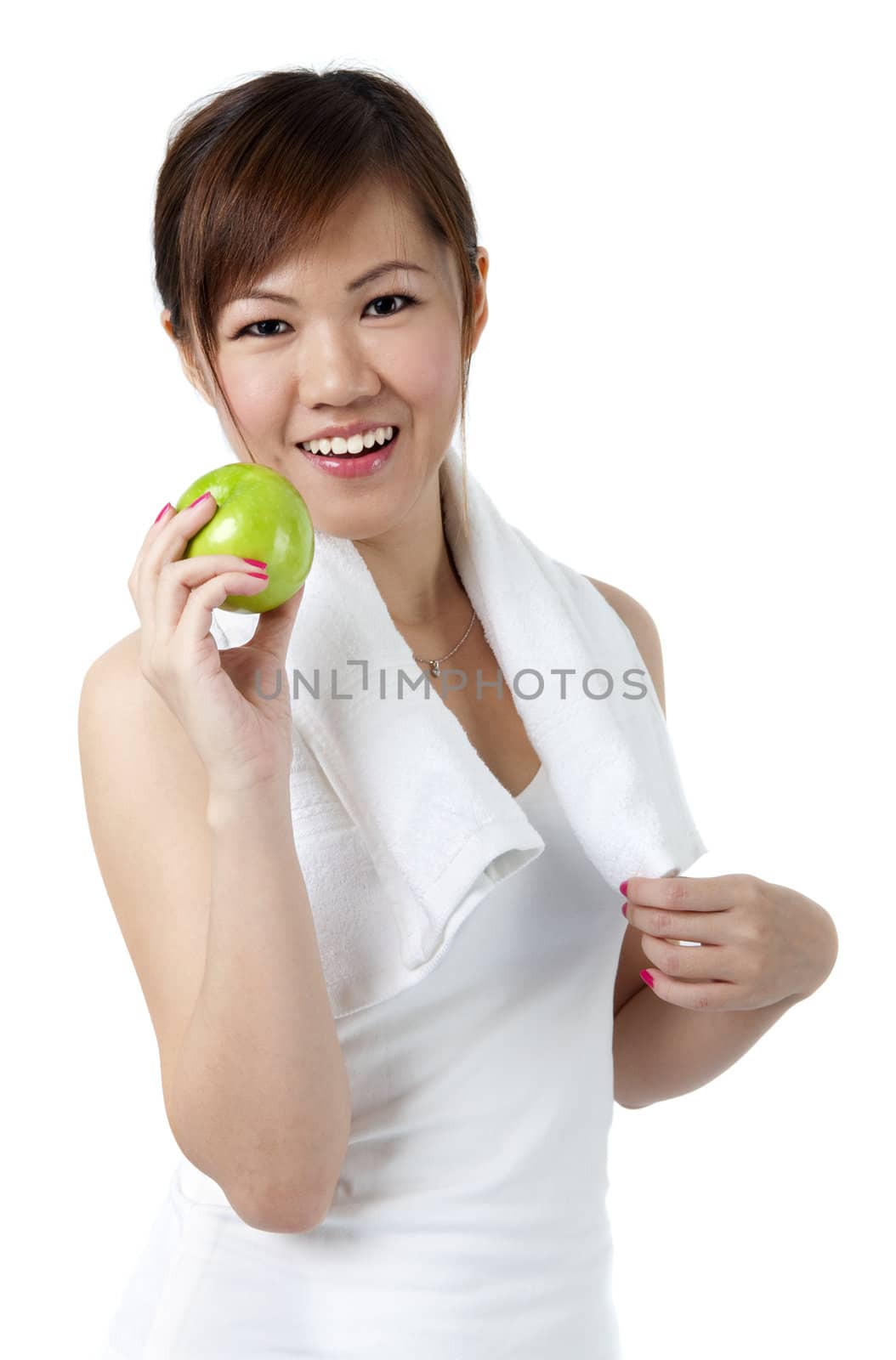 Beautiful young woman eating apple after work out. Isolated over white.