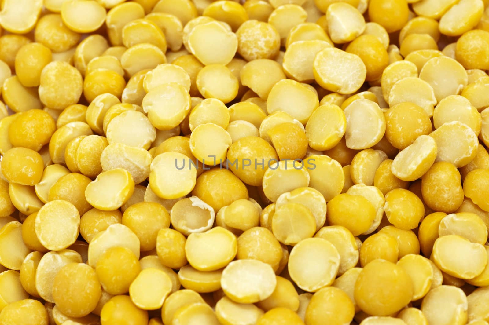 Close up on split yellow peas background