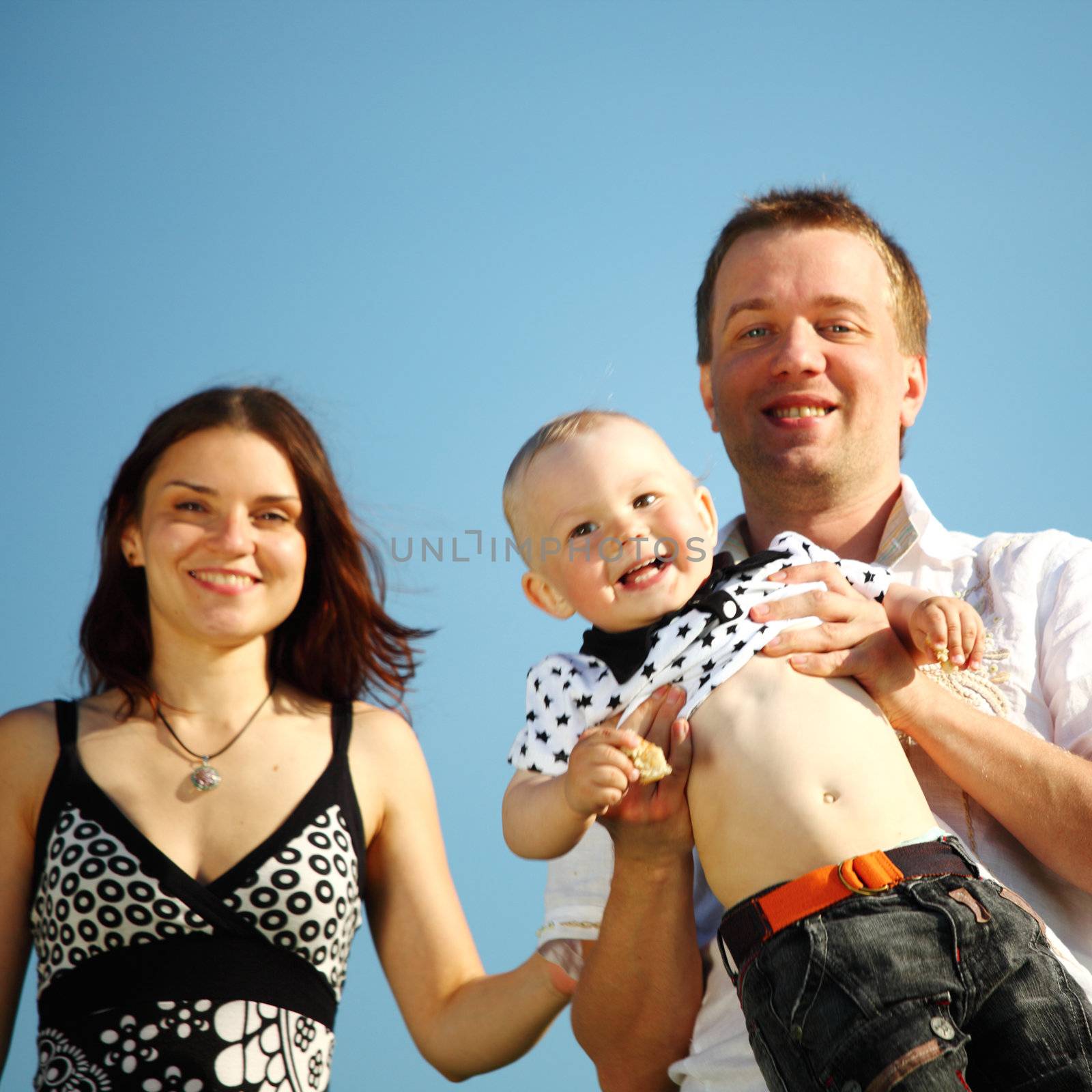 happy family blue sky on background