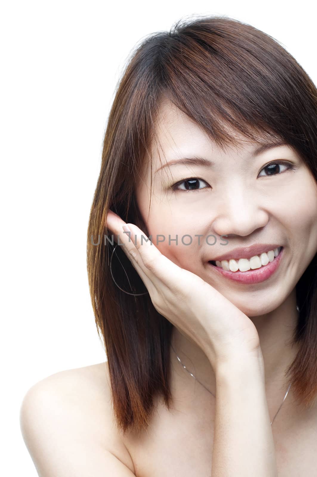 Close up of smiling Asian woman on white background