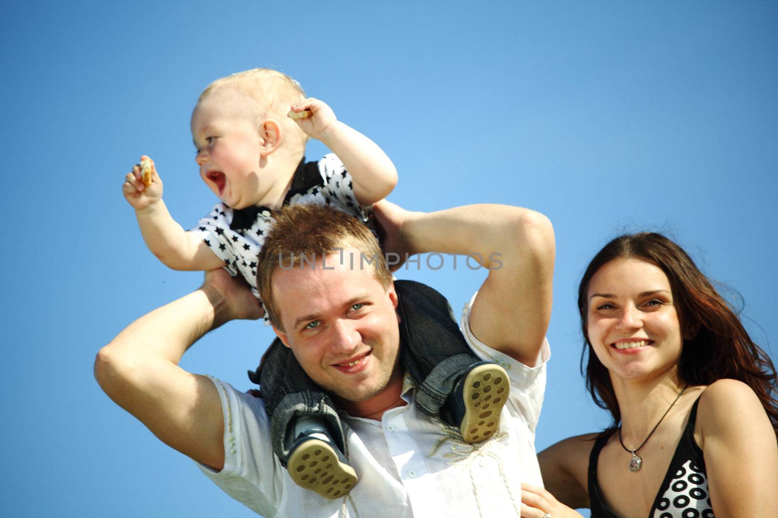 happy family blue sky on background