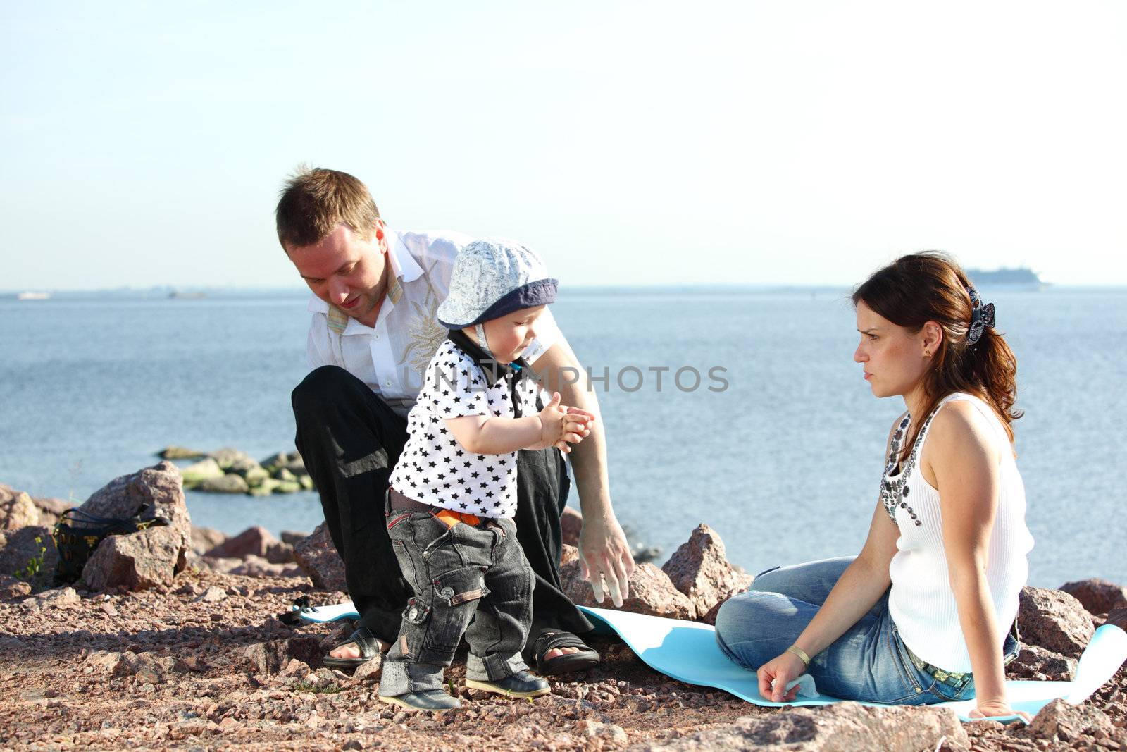 happy family on picnic sea on background