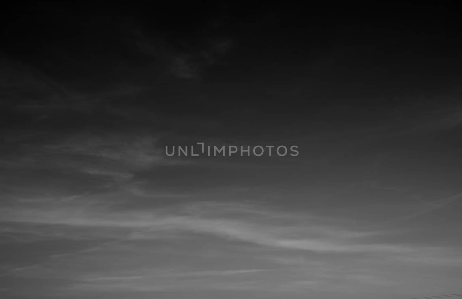 dark sky with cirrostratus in black & white photo