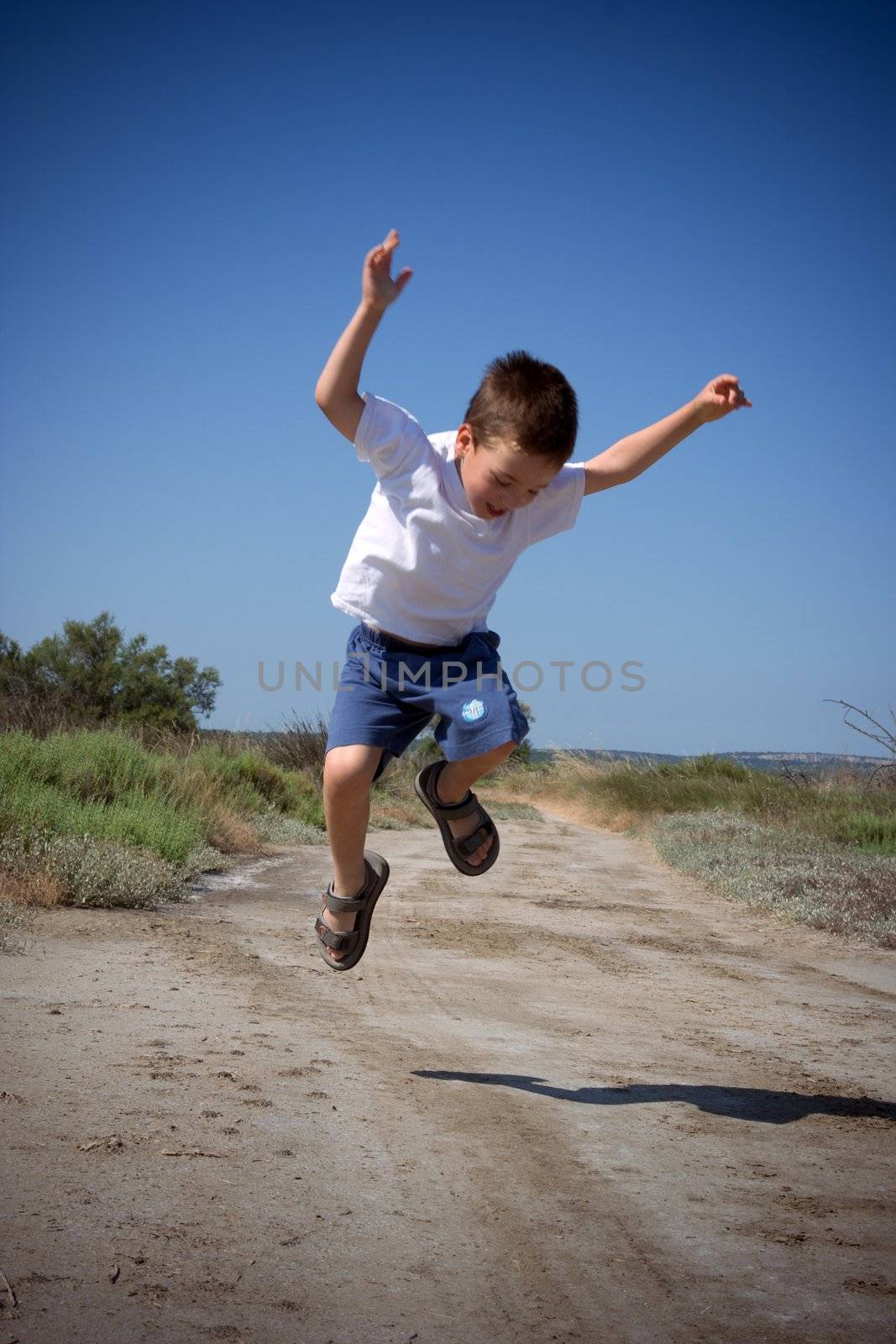 happy jumping child by chrisroll