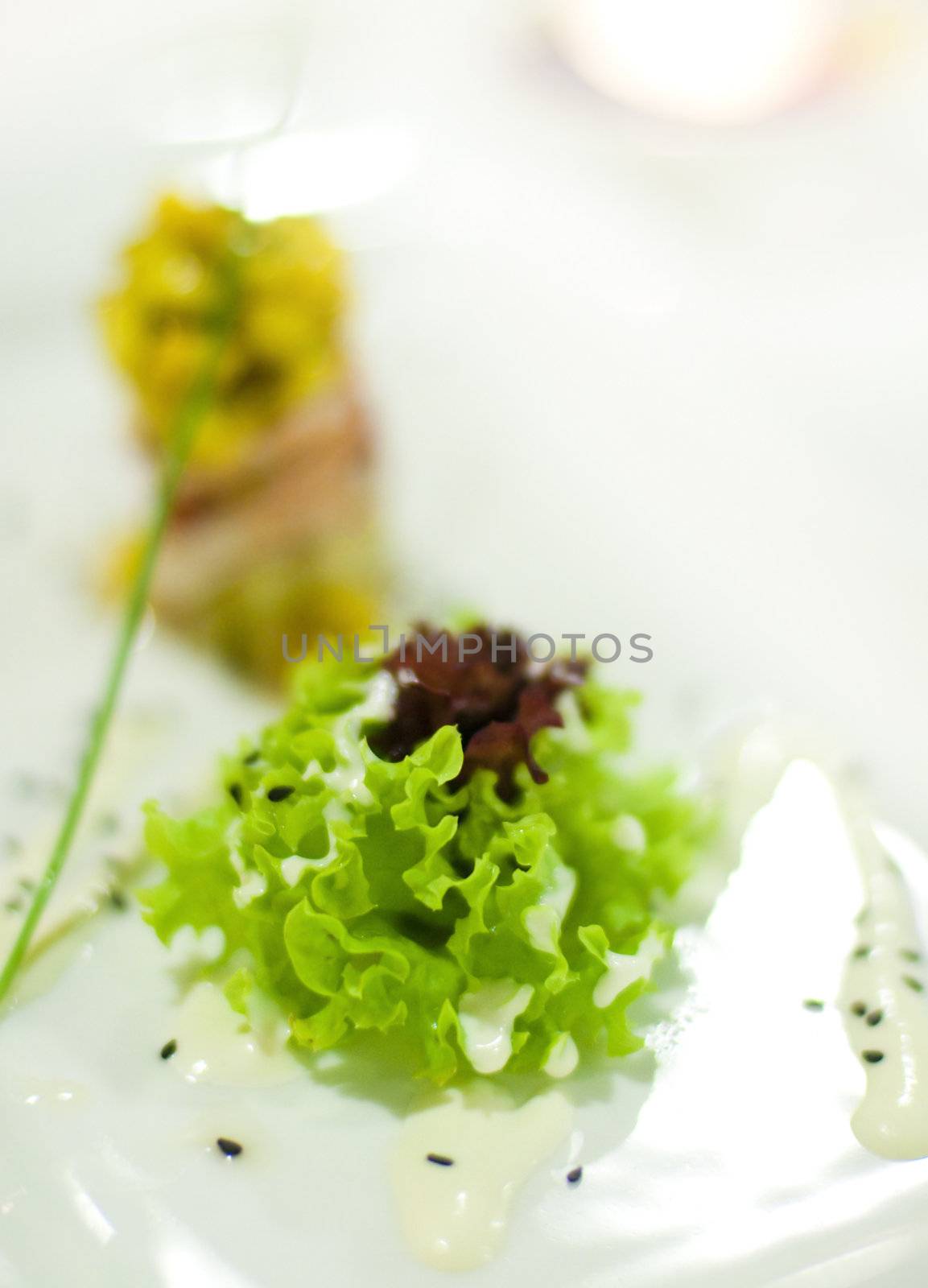 Fresh coral lettuce with creamy French dressing.