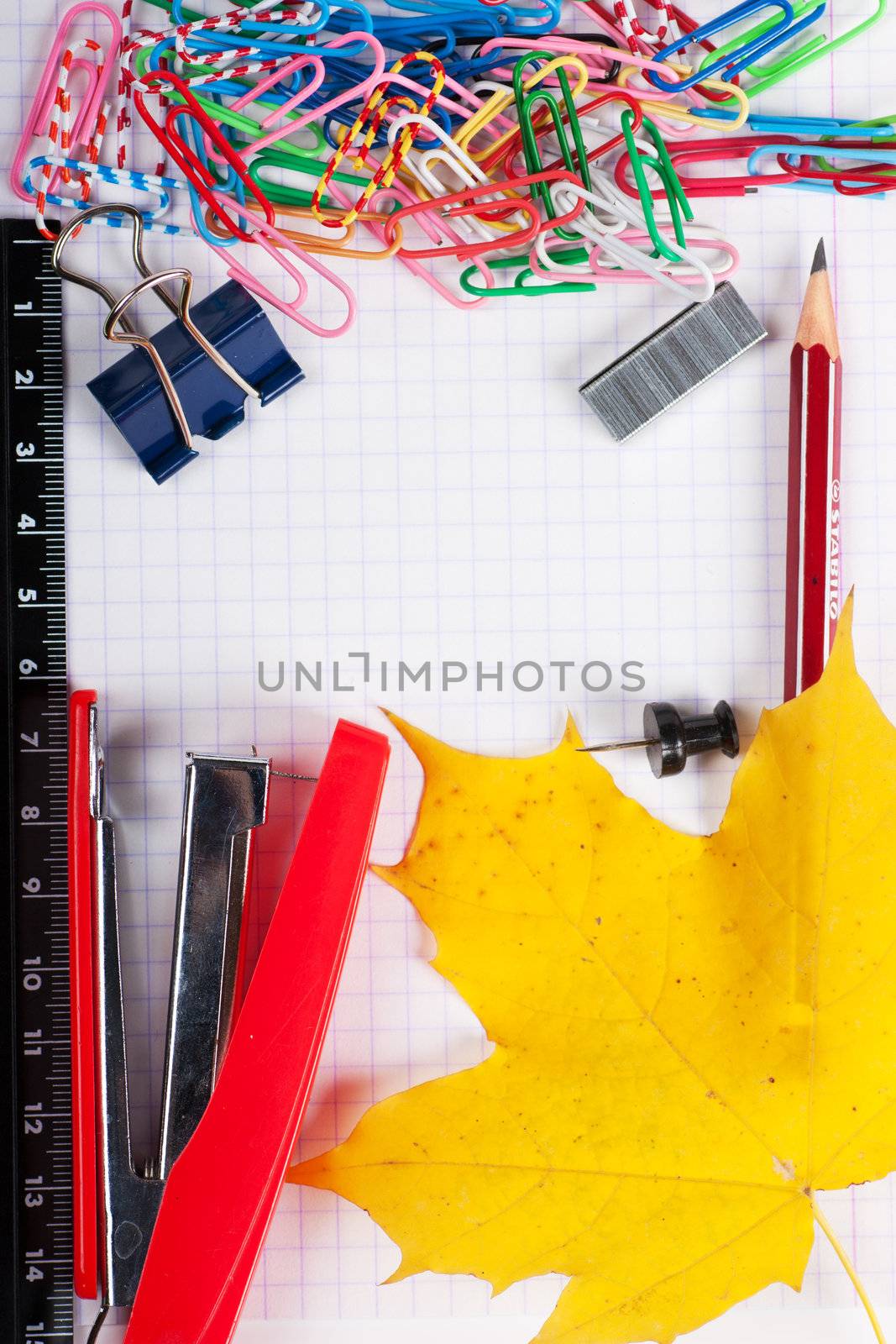 Closeup view of different stationary tools on a paper with place for your text