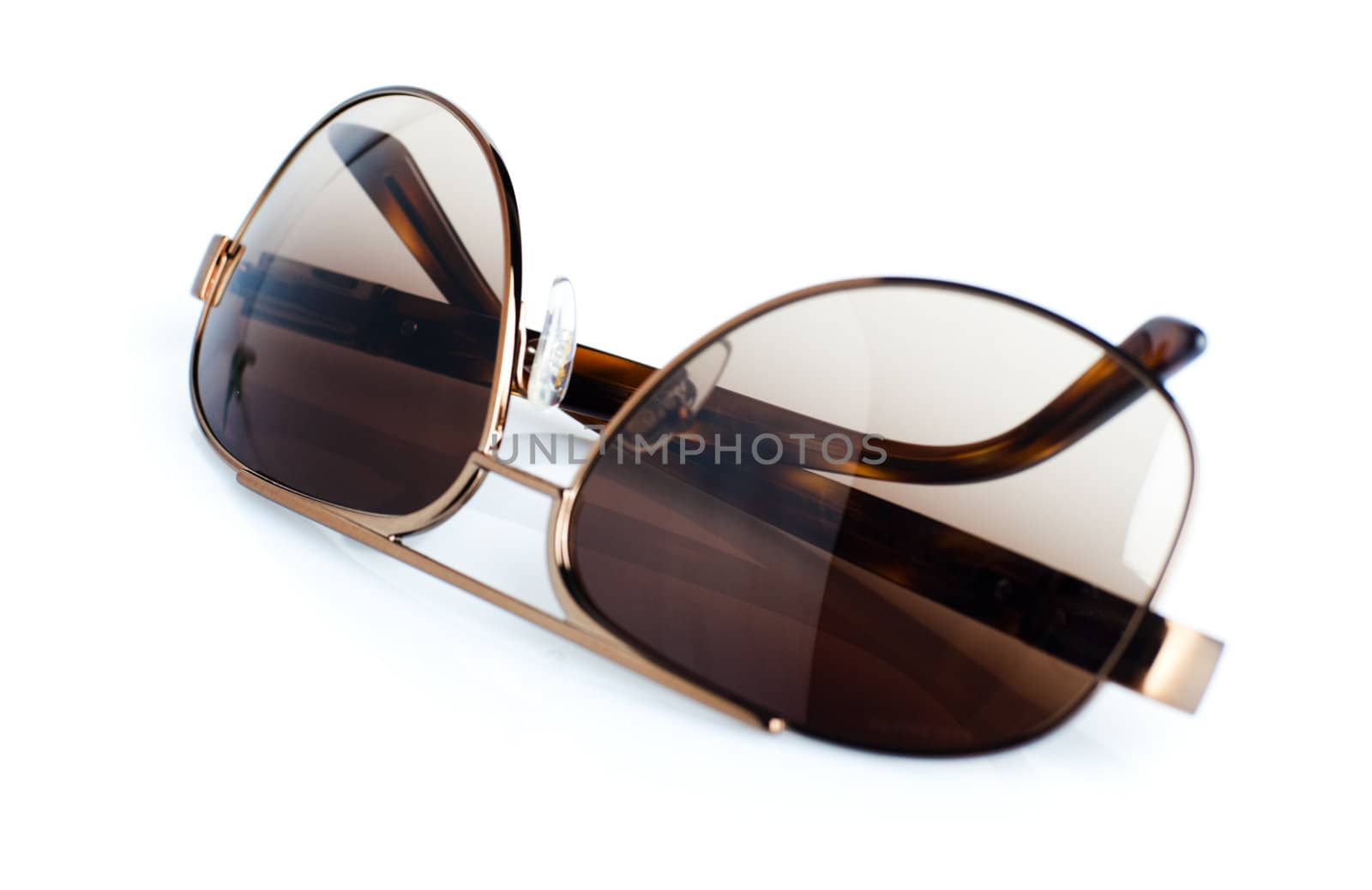 Brown luxury sunglasses isolated on white background
