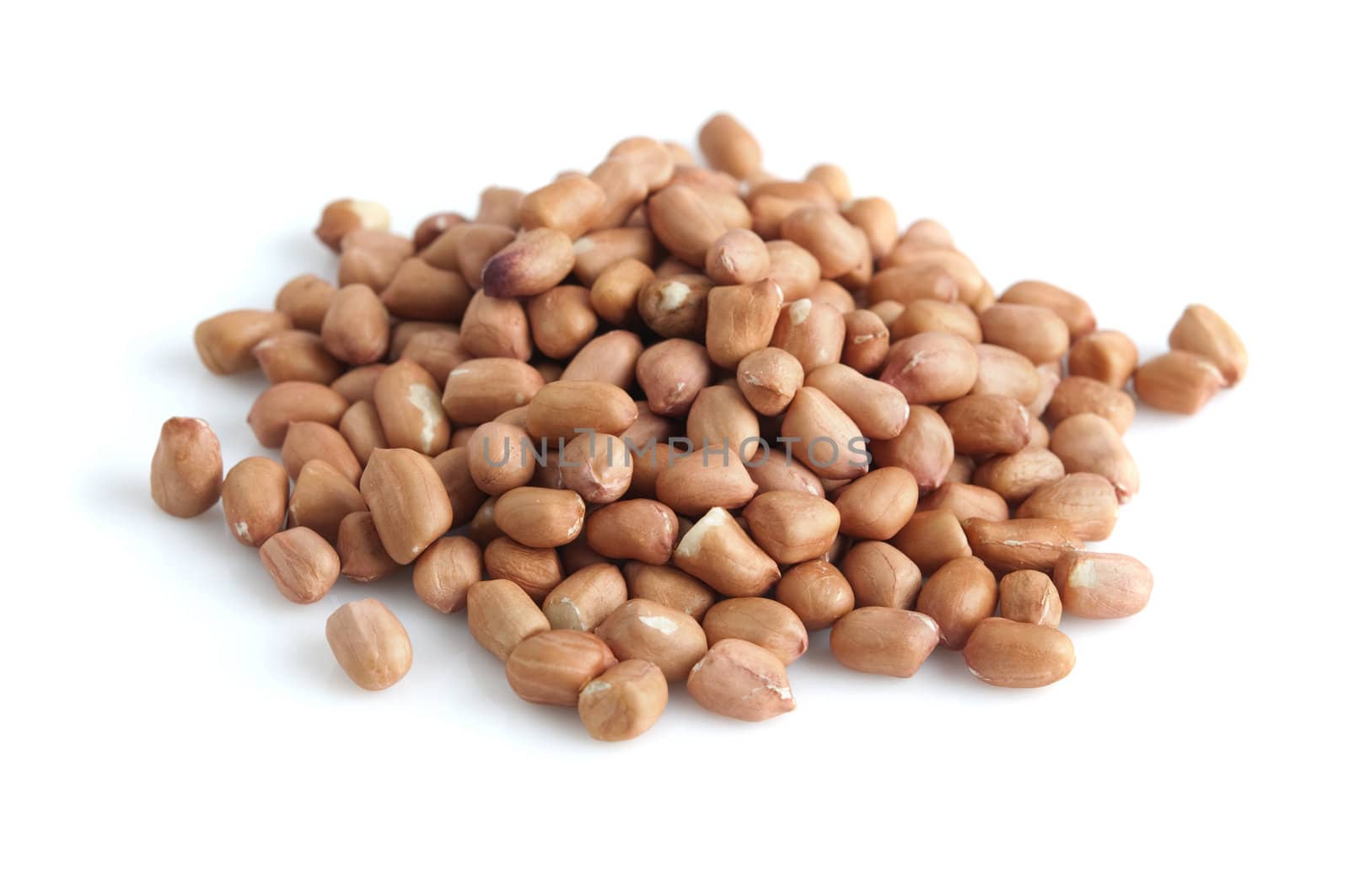 Pile of peanuts with skin isolated on white.