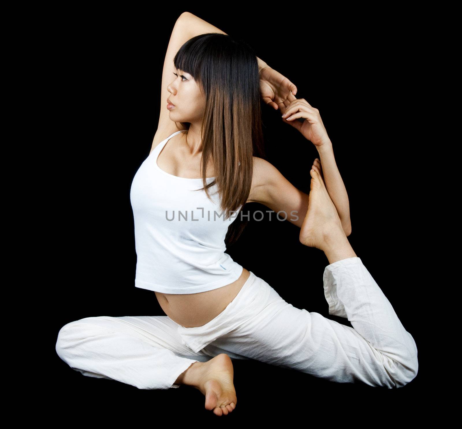 Woman in One-Legged King Pigeon Pose, on background.