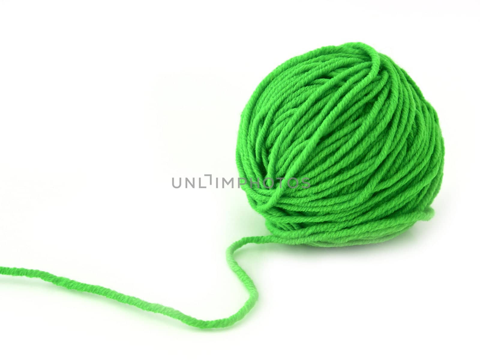 Green thread ball isolated on white background