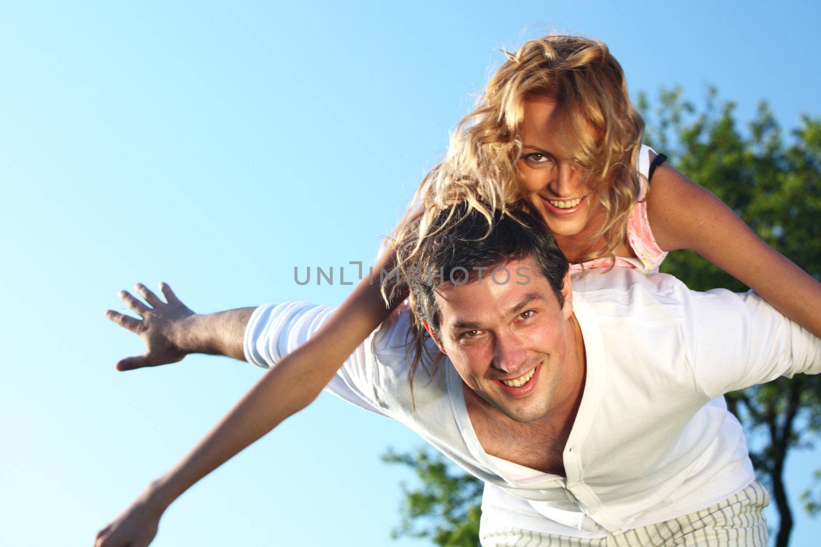 man and woman hug in the sky