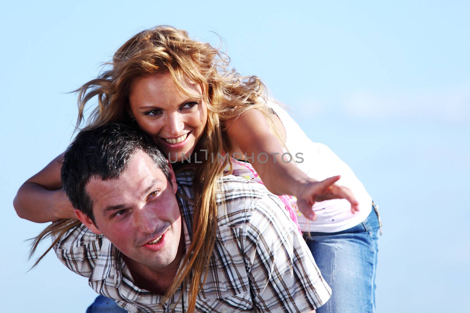 man and woman hug in the sky and sea on sea