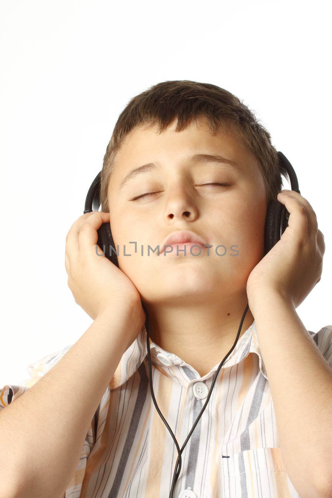 Boy  listening to music  by alexkosev