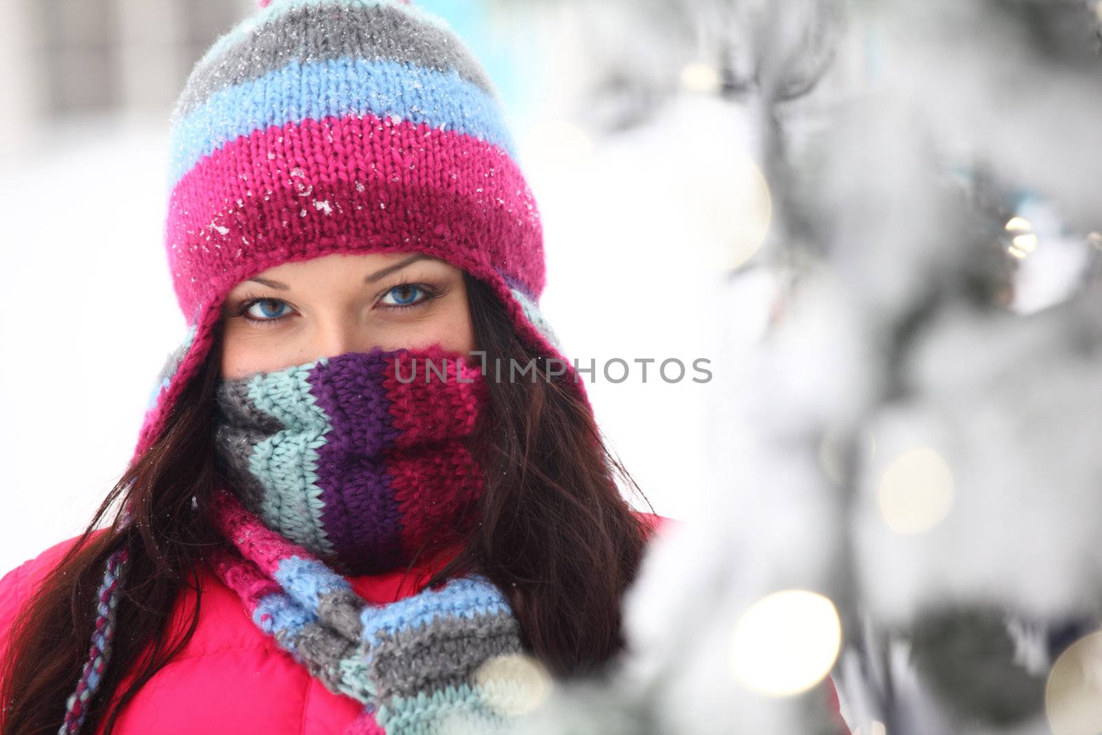 woman in winter hat and holyday bokeh