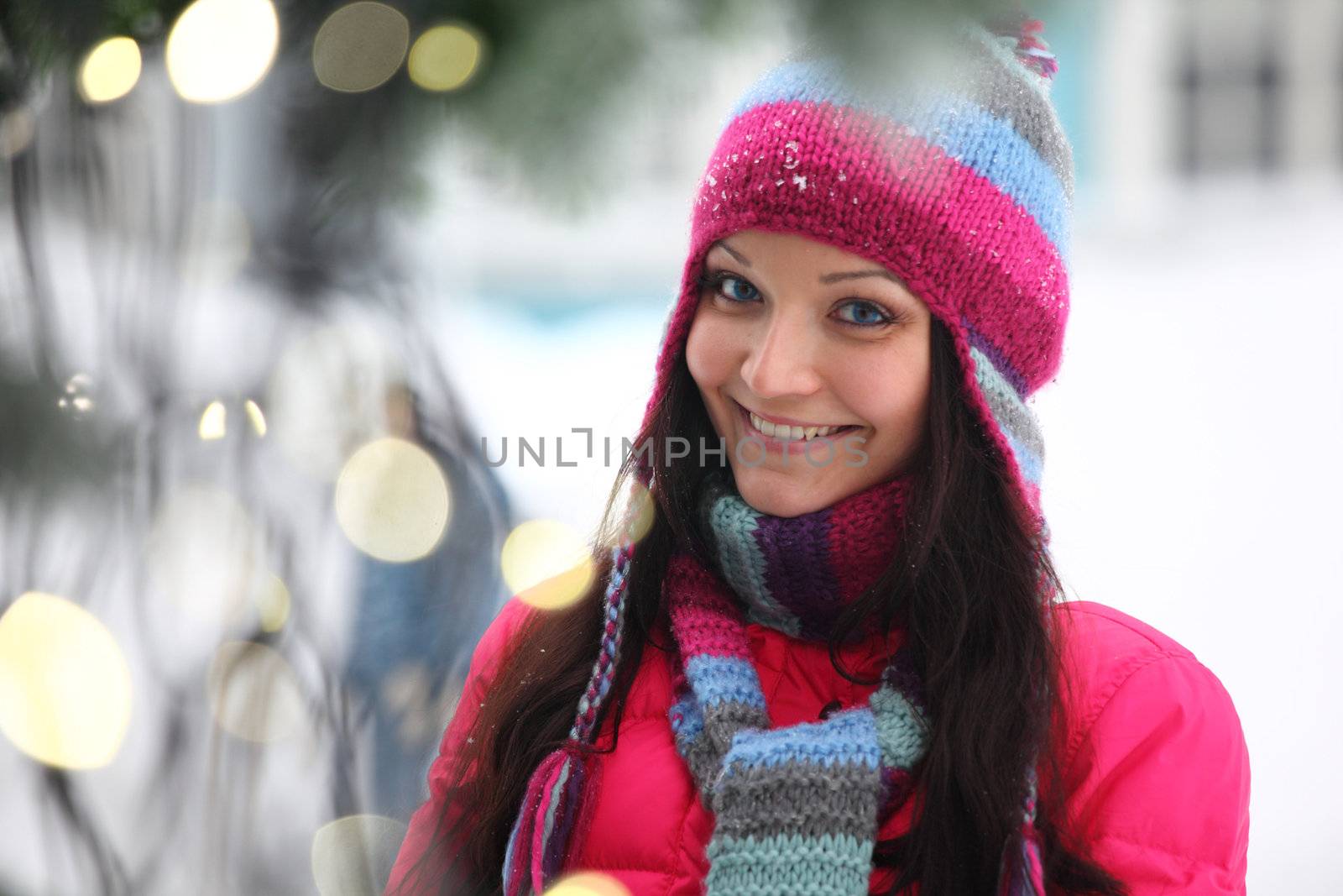 woman in winter hat and holyday bokeh