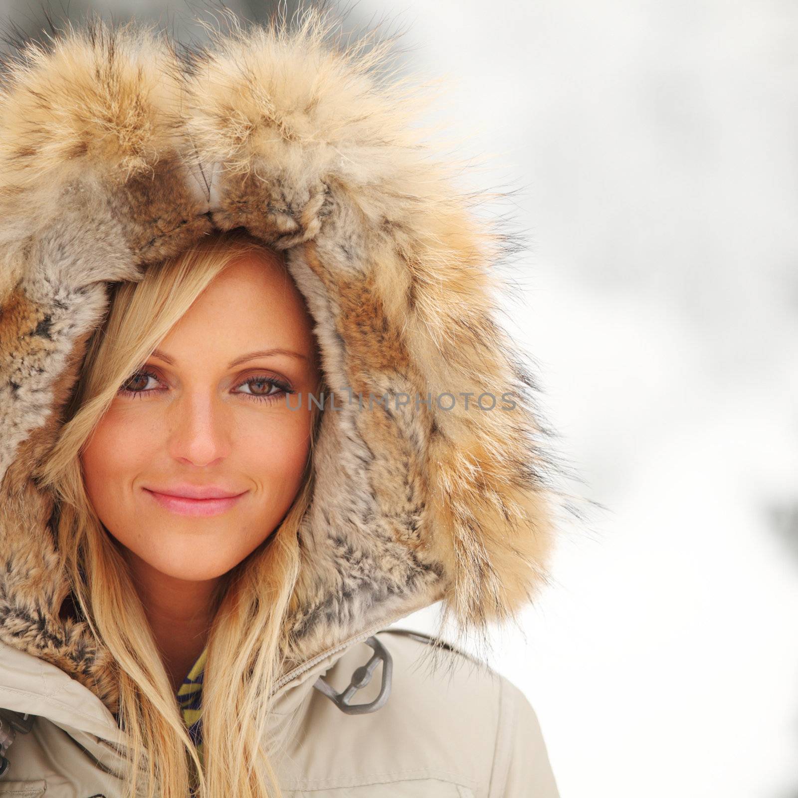 woman in winter park snow on background