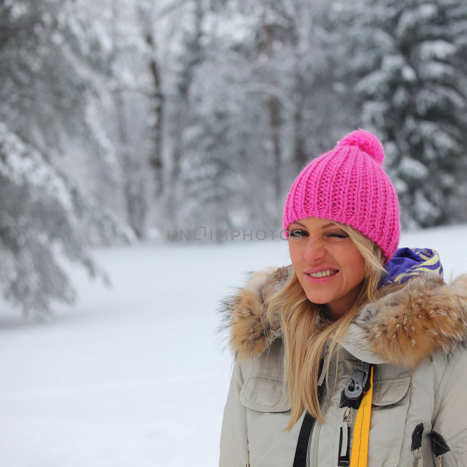 woman in winter park snow on background