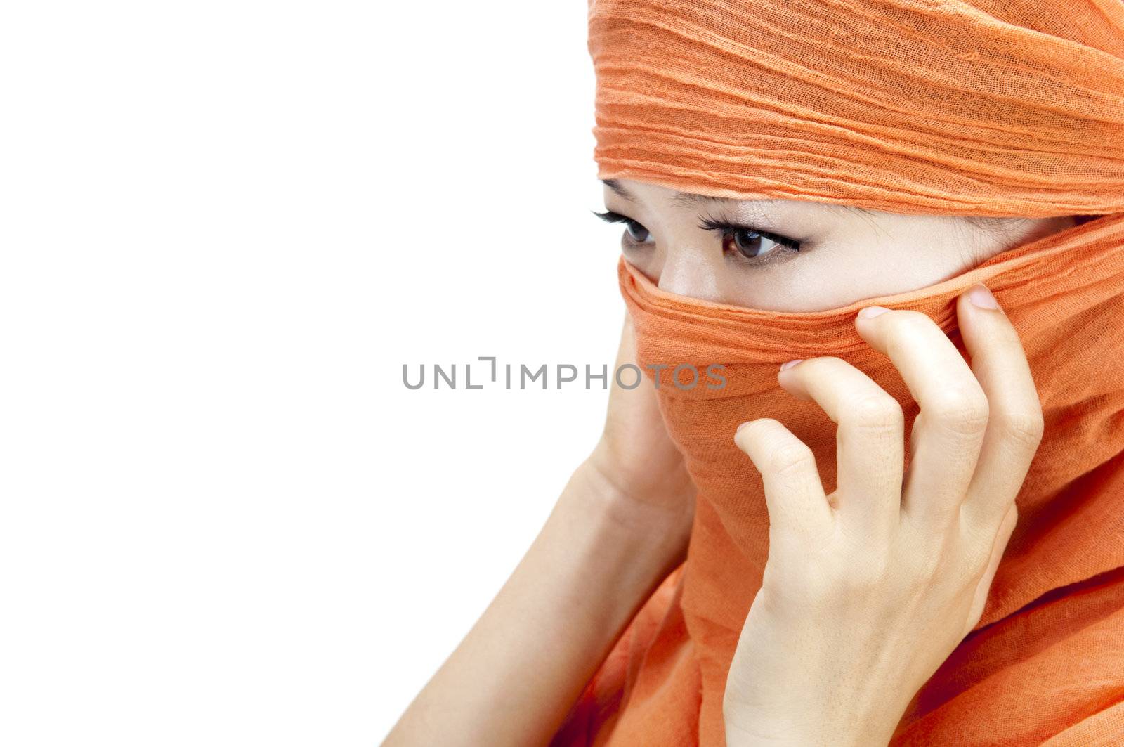 Close up picture of a Muslim woman wearing a orange veil