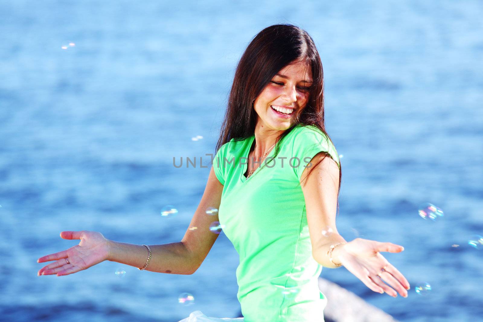 woman relax blue sea and bubbles on background