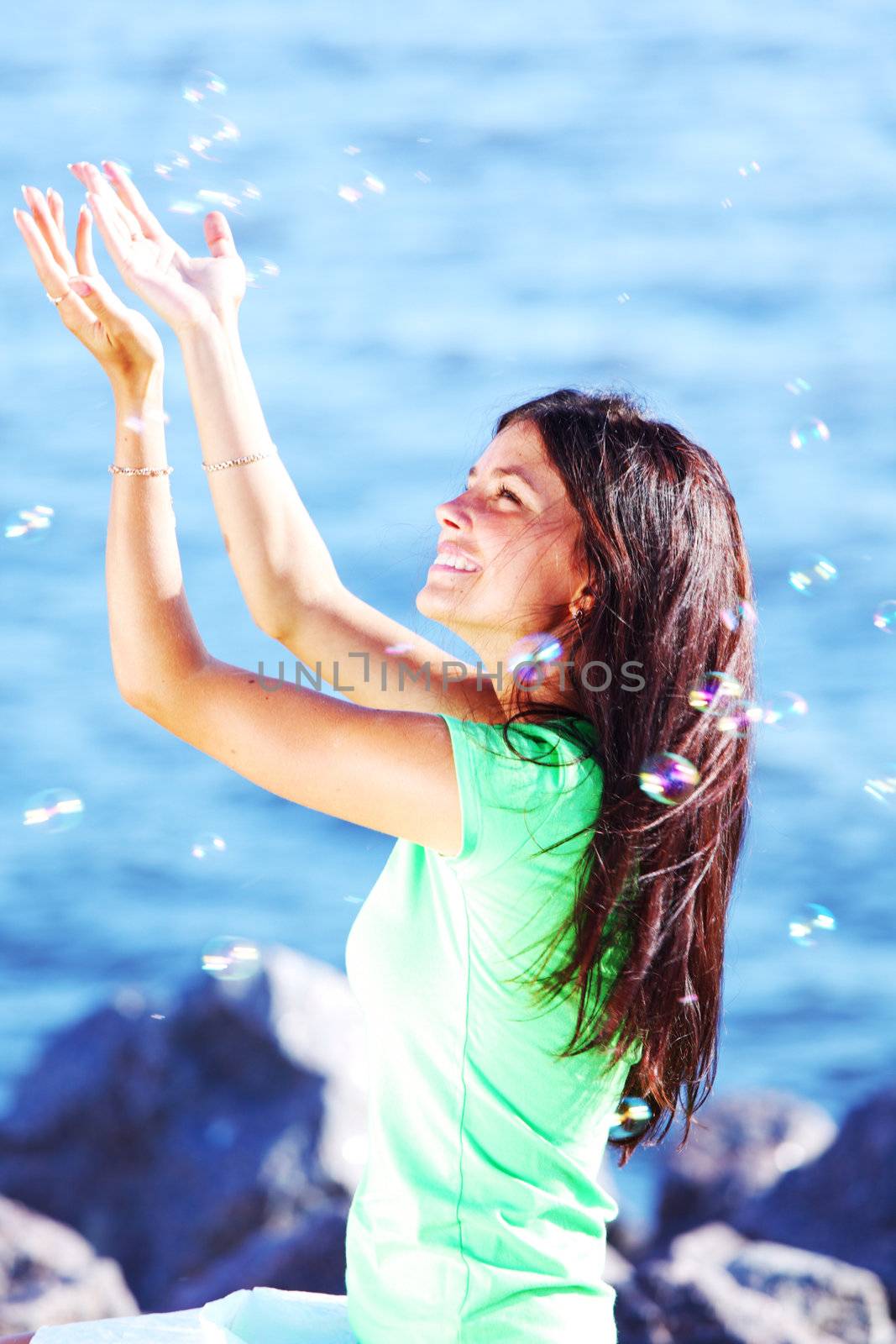 woman relax blue sea and bubbles on background
