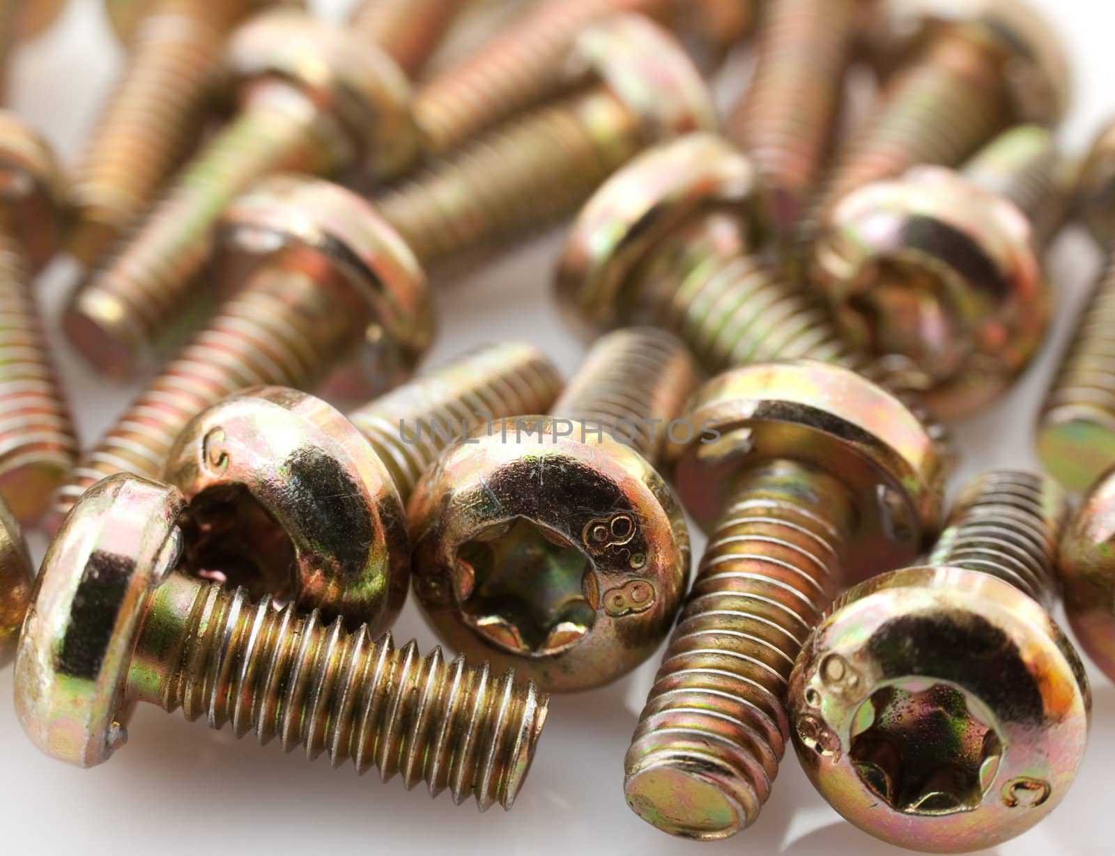 Metal bolts on white background