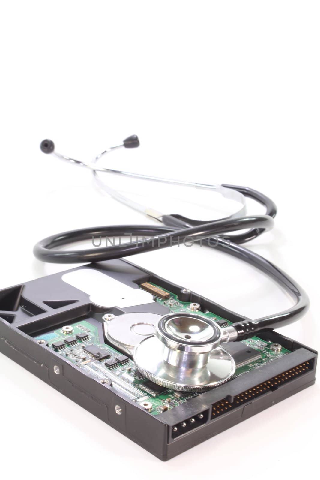 Hard disk with stethoscope on a white background