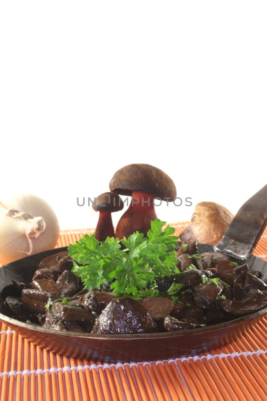 a mushroom pan with fresh wild mushrooms and parsley