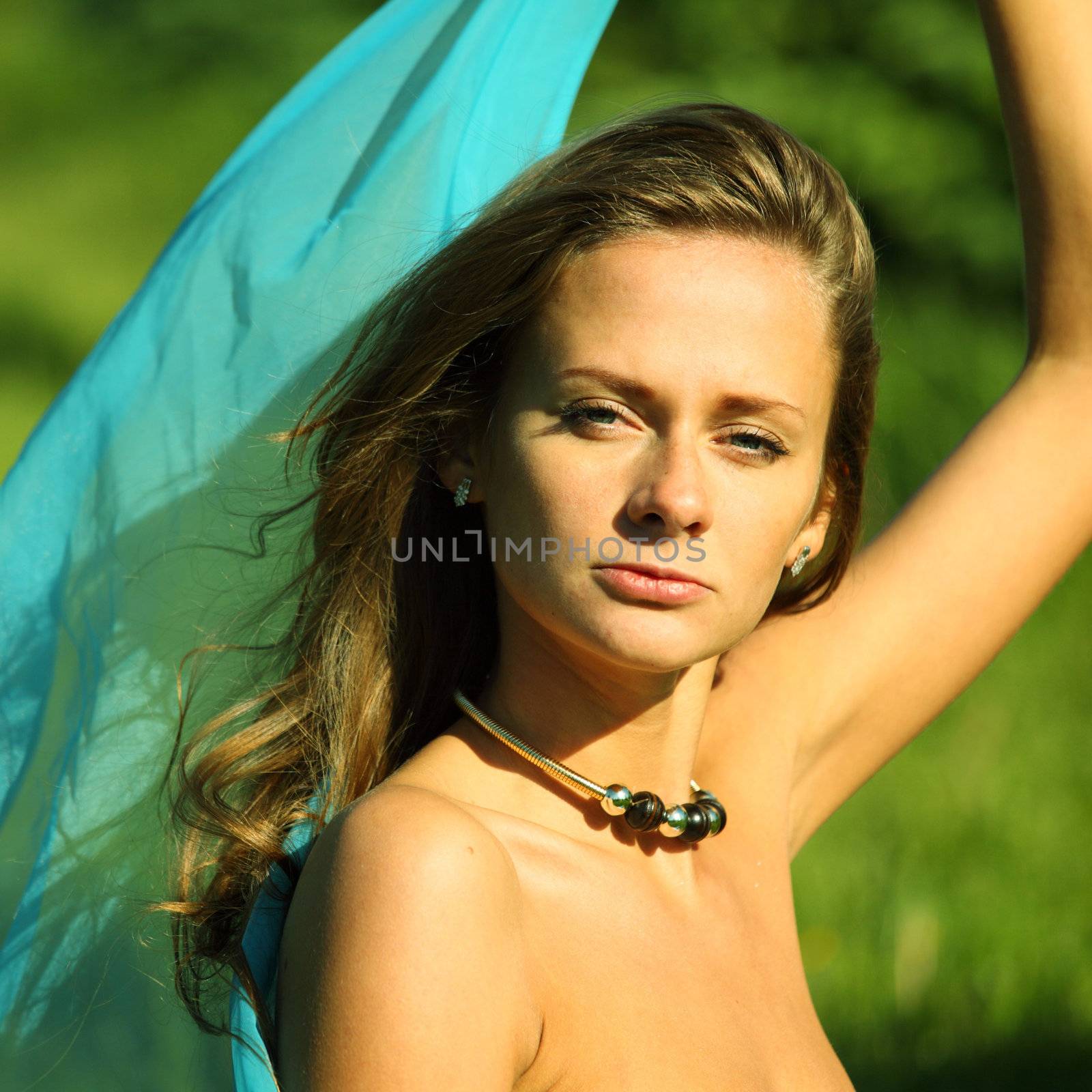 woman on the green grass happy and smile