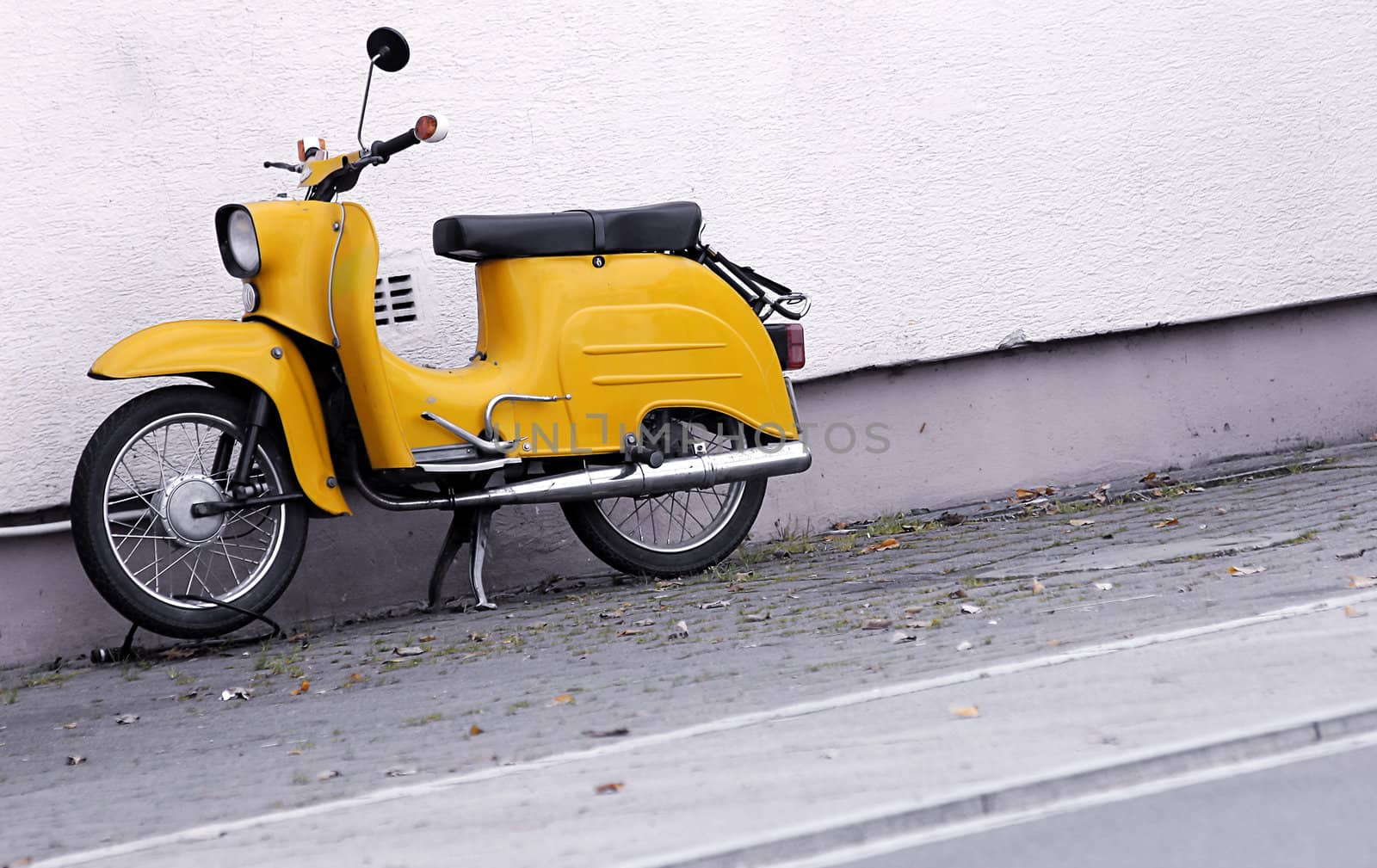 old yellow scooter in retro look design